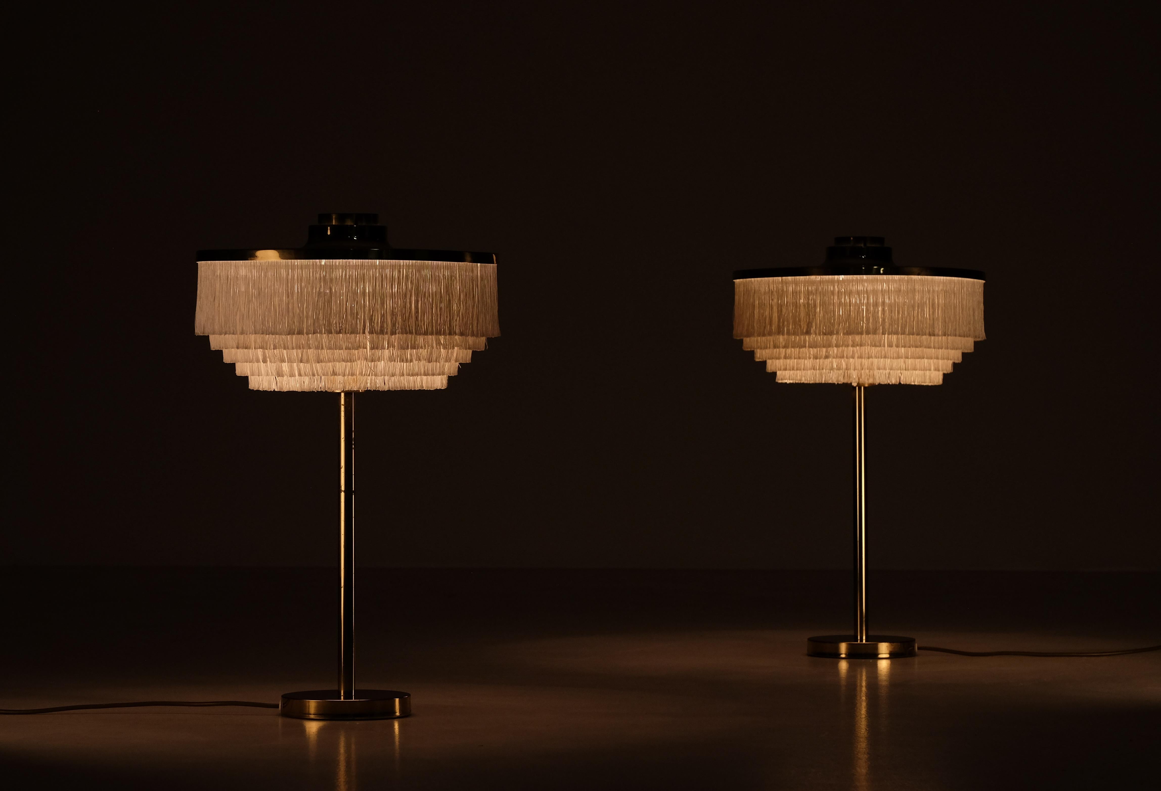 Rare pair of white table lamps model B-138 produced by Hans-Agne Jakobsson in Markaryd, Sweden.
