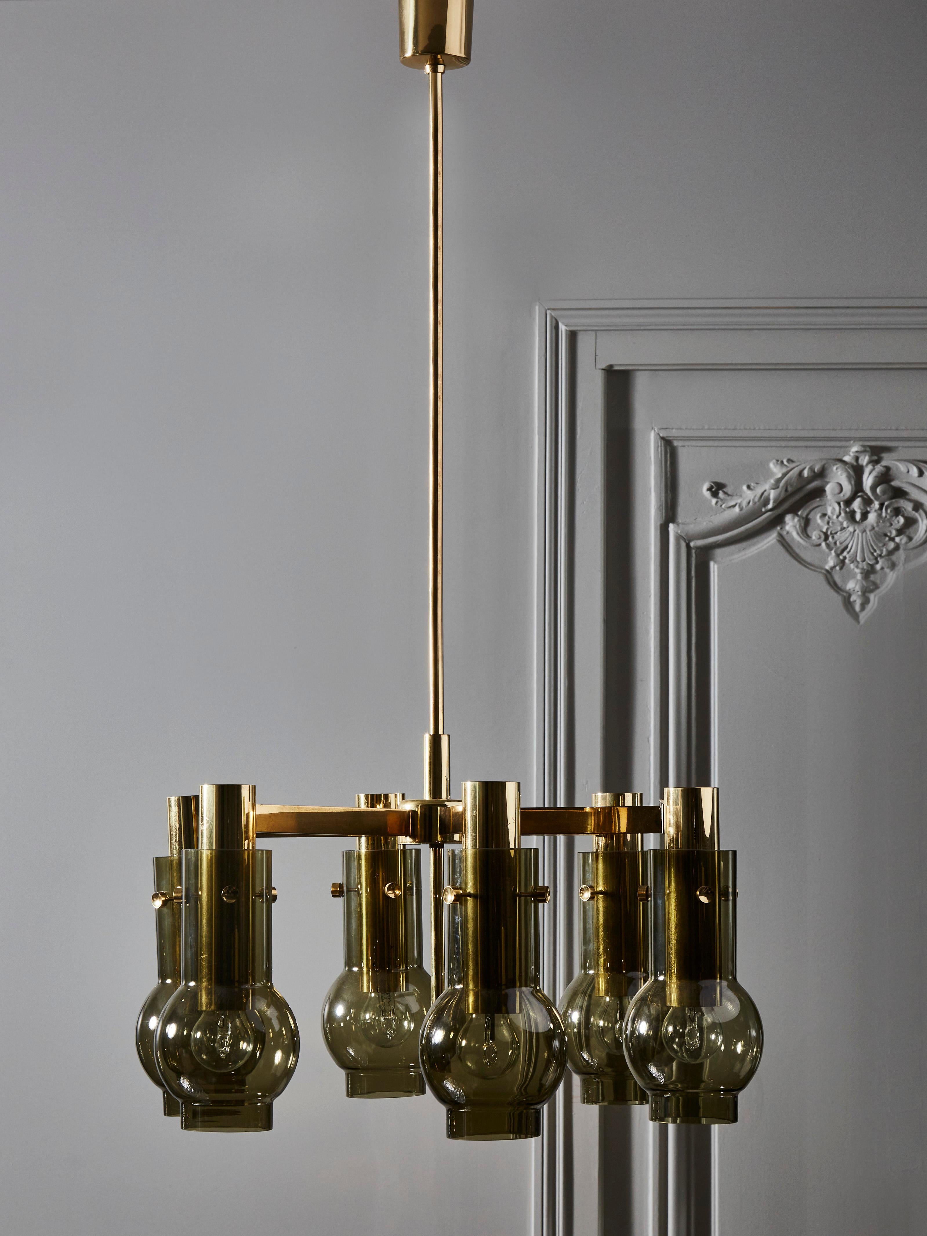 Pair of Hans-Agne Jakobsson chandelier made of six brass arms each holding a smoke grey shade.