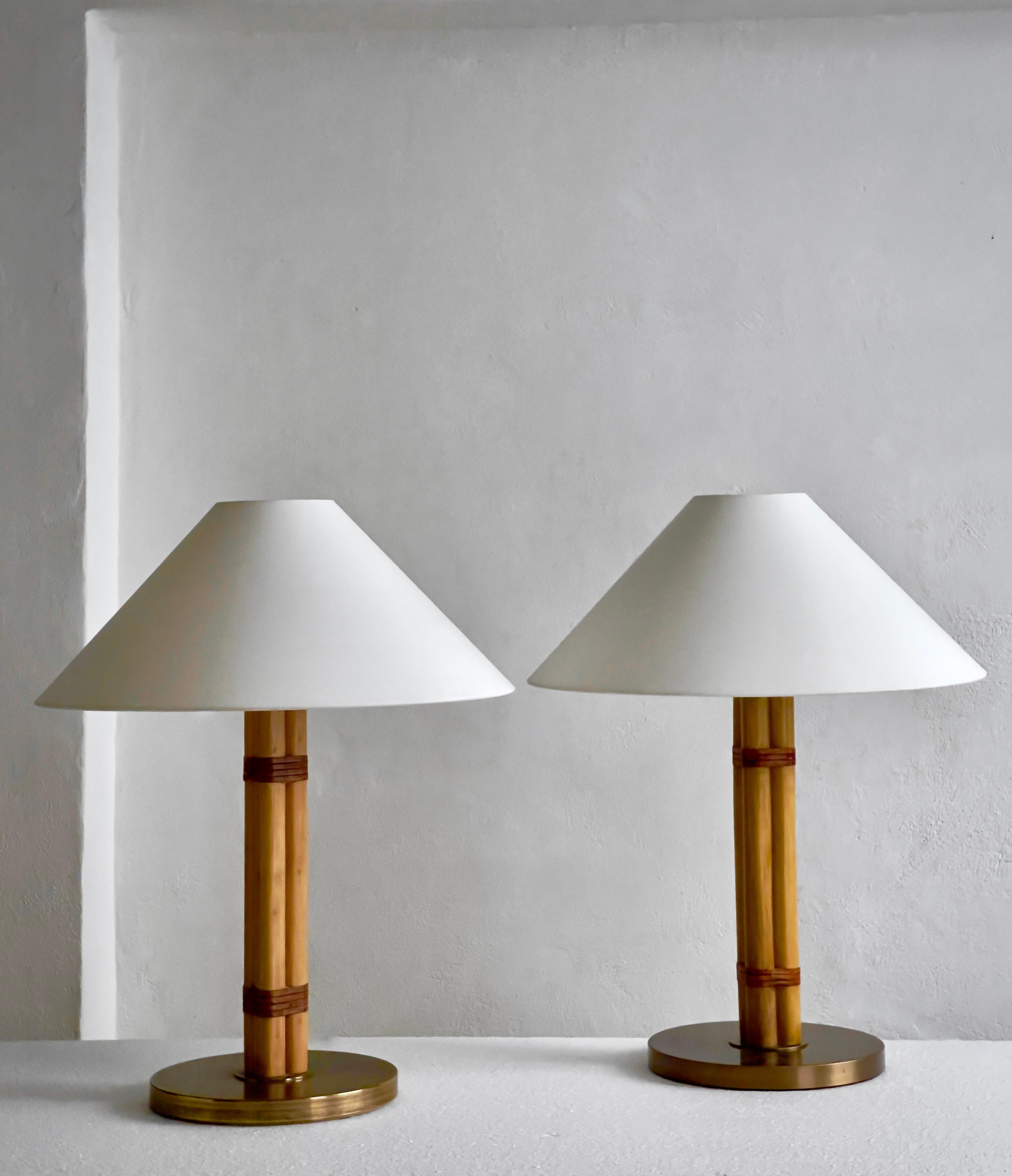 Scandinavian Modern Pair of Hans Agne Jakobsson table lamps in brass, leather and bamboo.Sweden 1970 For Sale