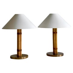 Vintage Pair of Hans Agne Jakobsson table lamps in brass, leather and bamboo.Sweden 1970