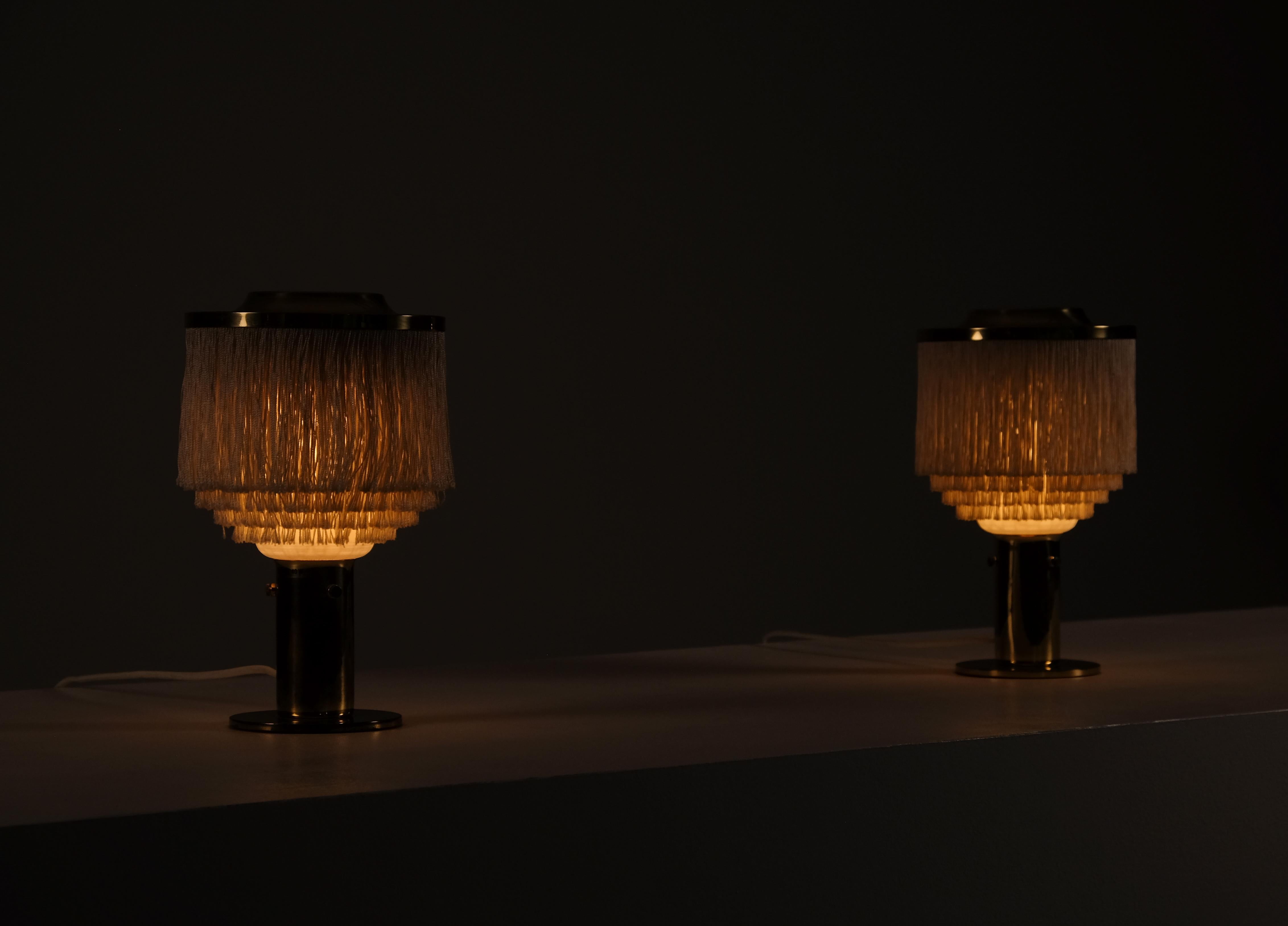 Ivory white fringes, brass and opaline glass shades. Produced by Hans-Agne Jakobsson, Markaryd, 1960s.
