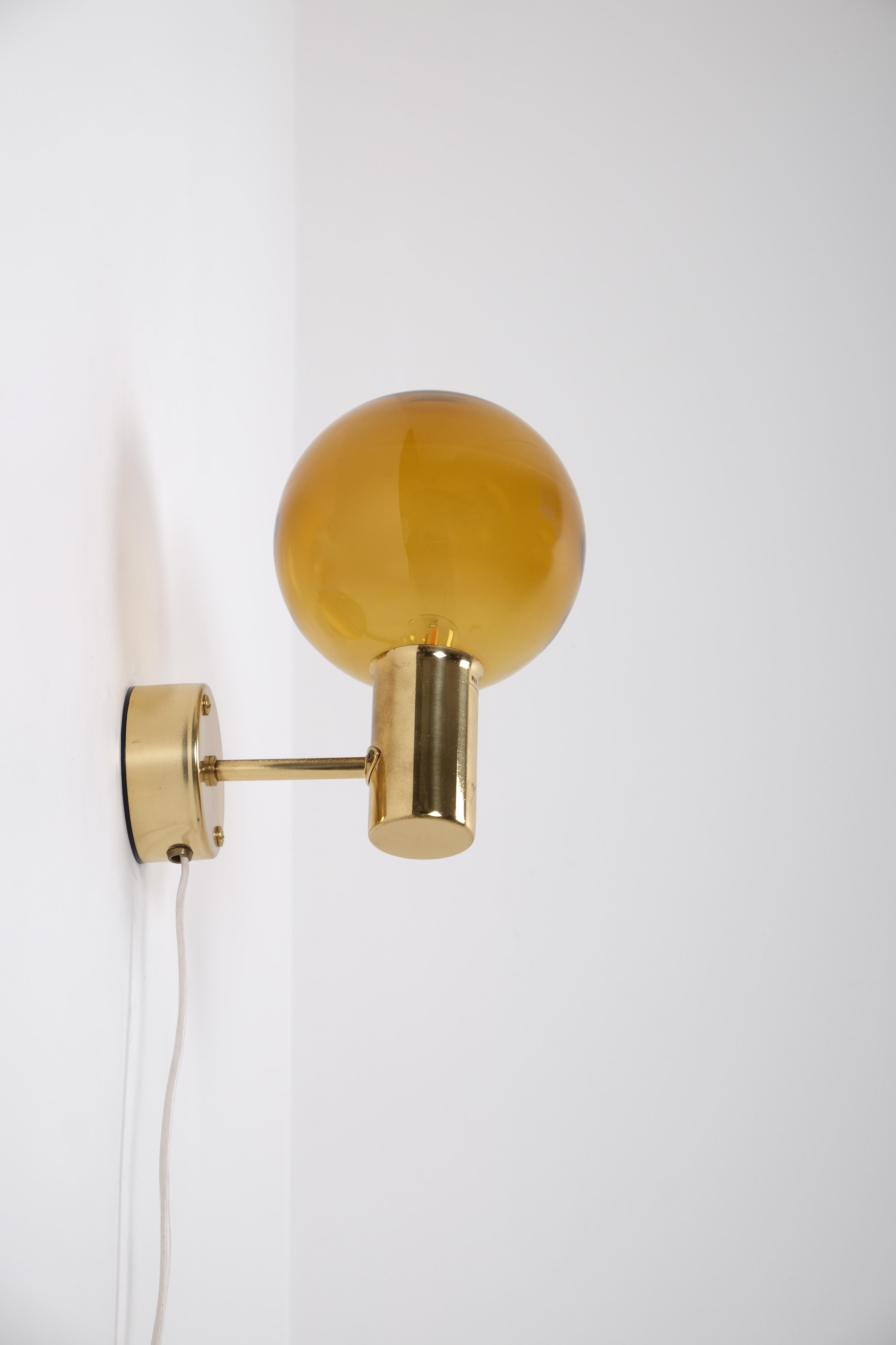 Pair of brass wall lights 'Patricia' with smoked glass, designed and produced by Hans-Agne Jakobsson, Markaryd, Sweden, 1960s.