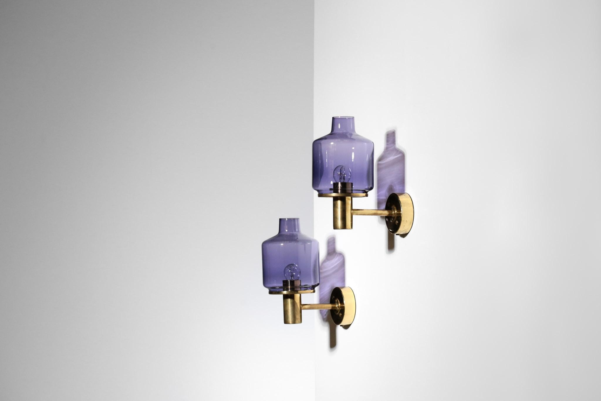 Really nice Hans Agne Jakobsson wall lights in brass and purple glass
Model V-212.