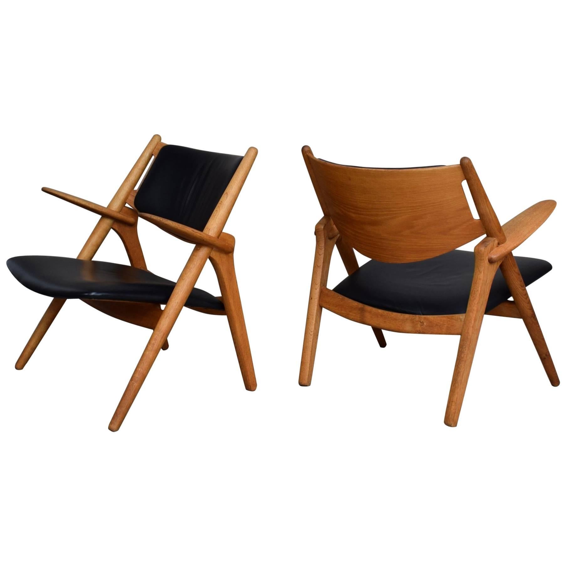 Pair of Hans J. Wegner CH28 Sawbuck Lounge Chairs, Denmark, circa 1950