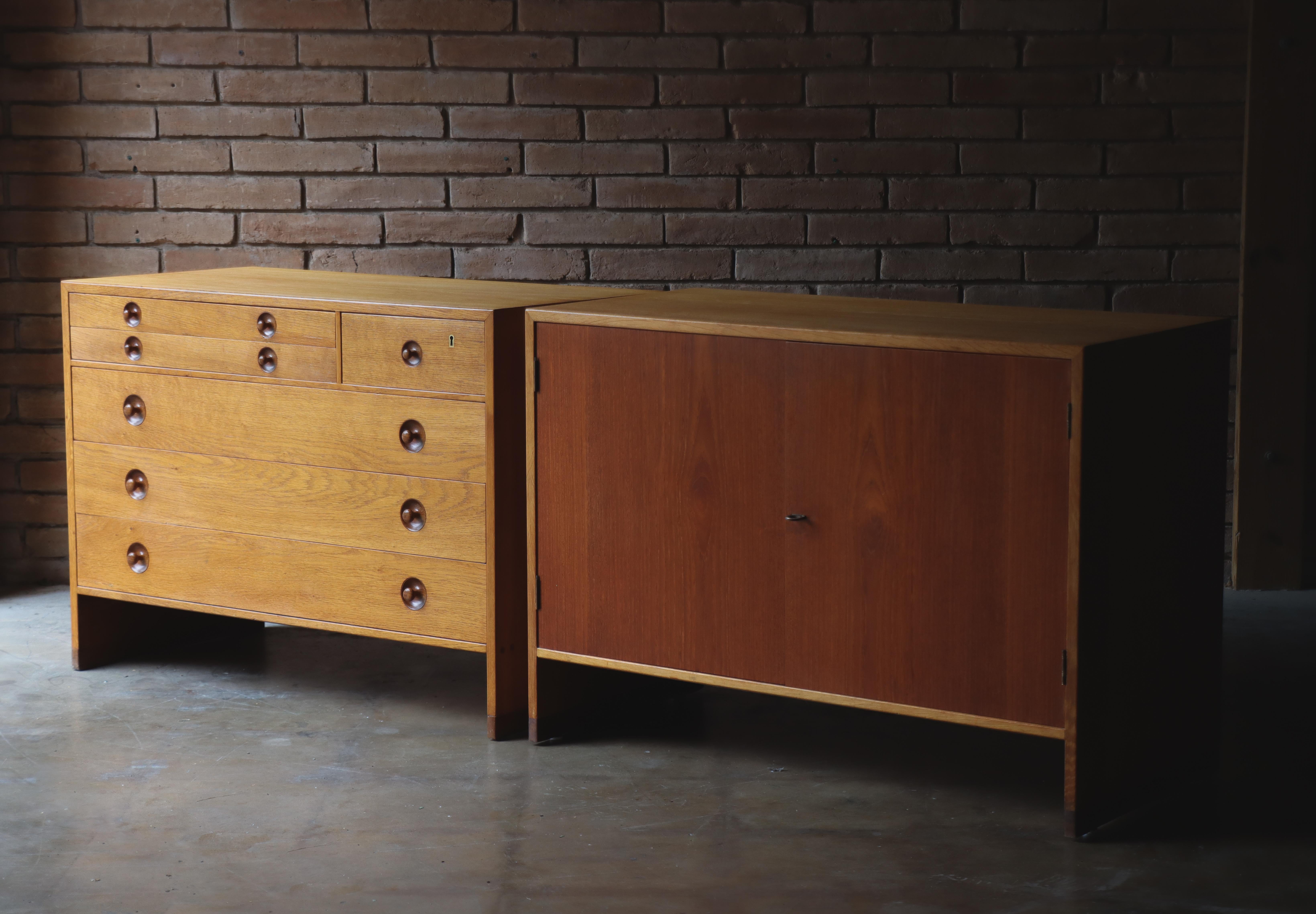 A thoughtfully paired set of storage cabinets designed by Hans J. Wegner for Ry Møbler, Denmark, 1950s. 

Constructed in white oak, the two pieces share a crisp architectural presence, yet offer distinct functions: one with a bank of drawers, the