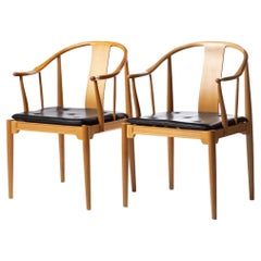 Pair of Hans J. Wegner 'China Chairs' Model FH4283 in Cherrywood and Black Leath