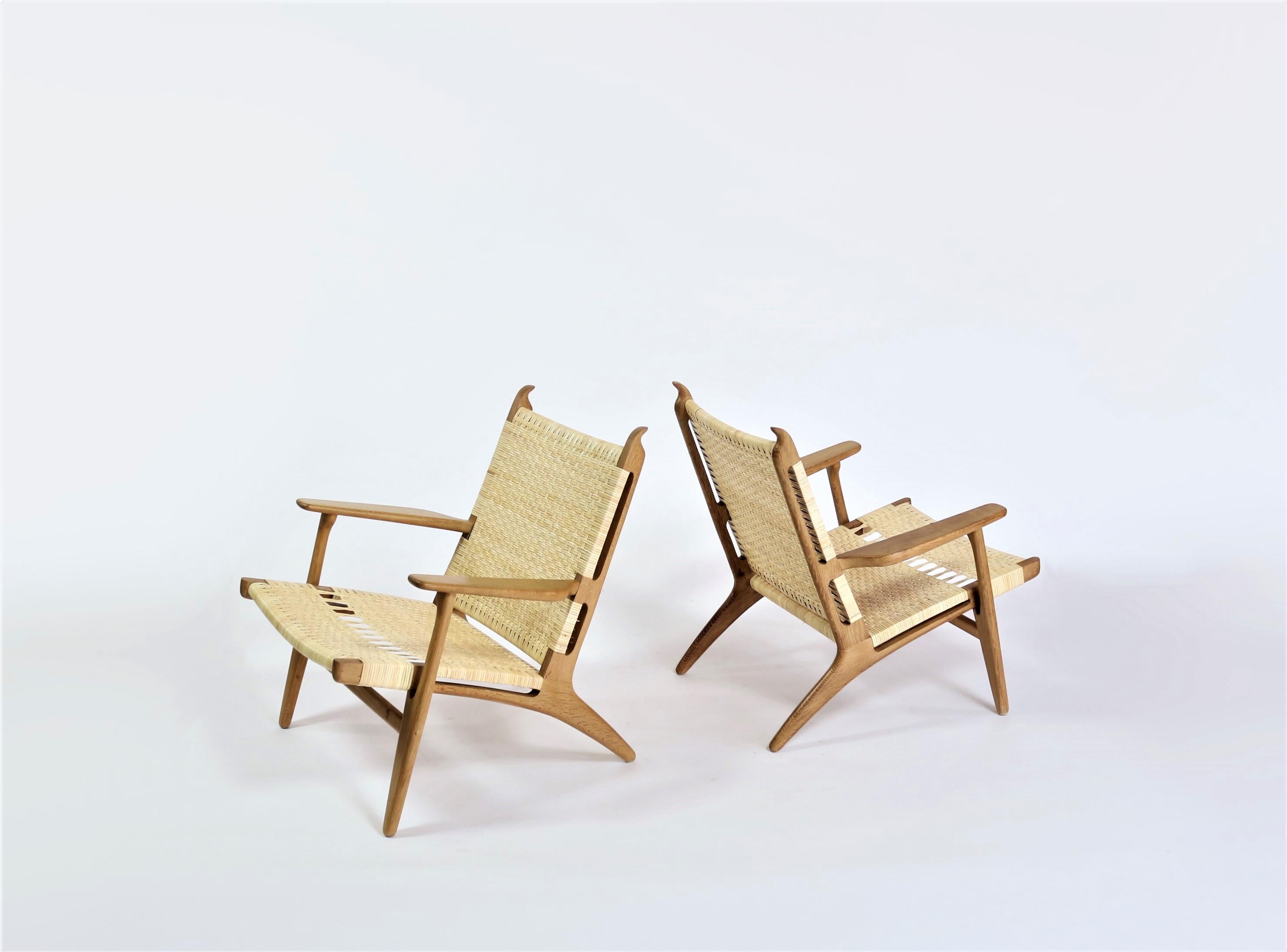 Stunning and rare pair of Danish modern lounge chairs from the 1950s by Hans J. Wegner. Model 