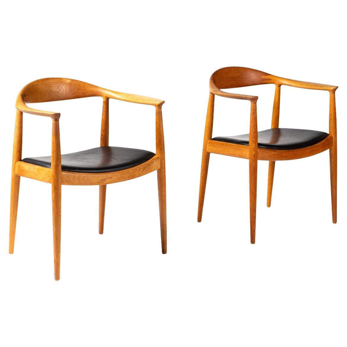 Hans J. Wegner Pair of “The Chair” JH503, Oak and Black Leather, Johannes Hansen