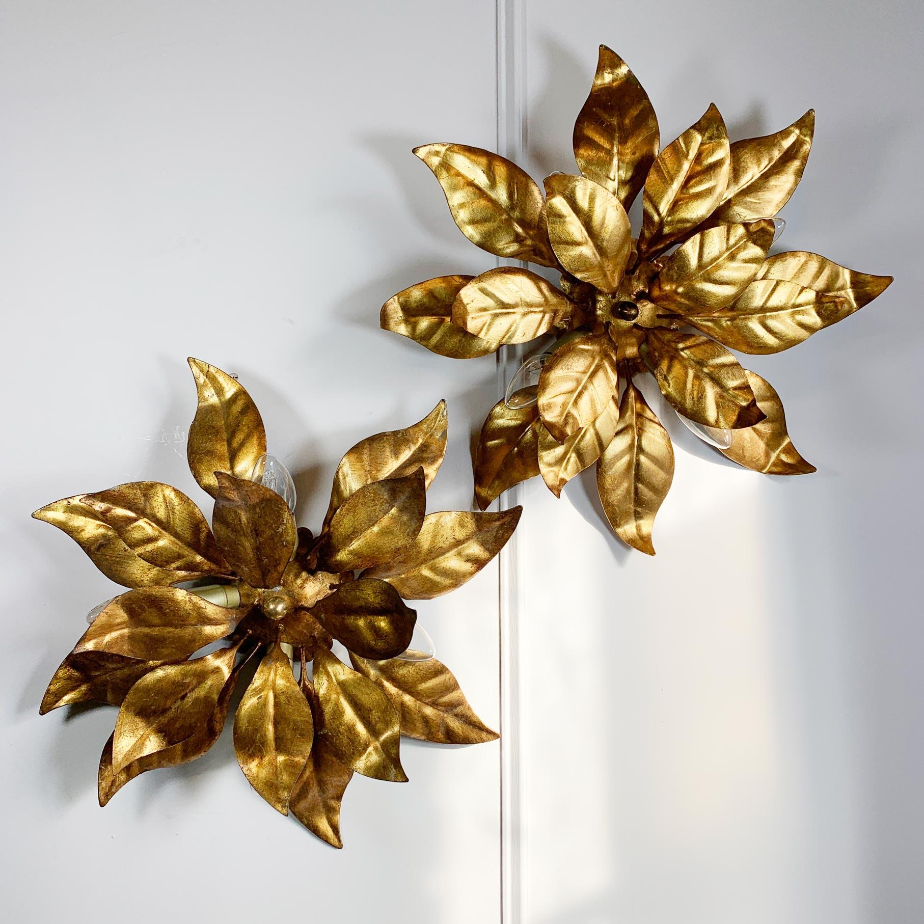 A matched pair of 1970's gilt leaf ceiling or wall lights by Hans Kogl, in the form of leaves.

Measures: 45cm width x 15cm depth. Back rose is 12cm across.

Price shown is for the pair.

