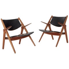 Pair of Hans Wegner CH 28 Sawbuck Armchairs, Denmark