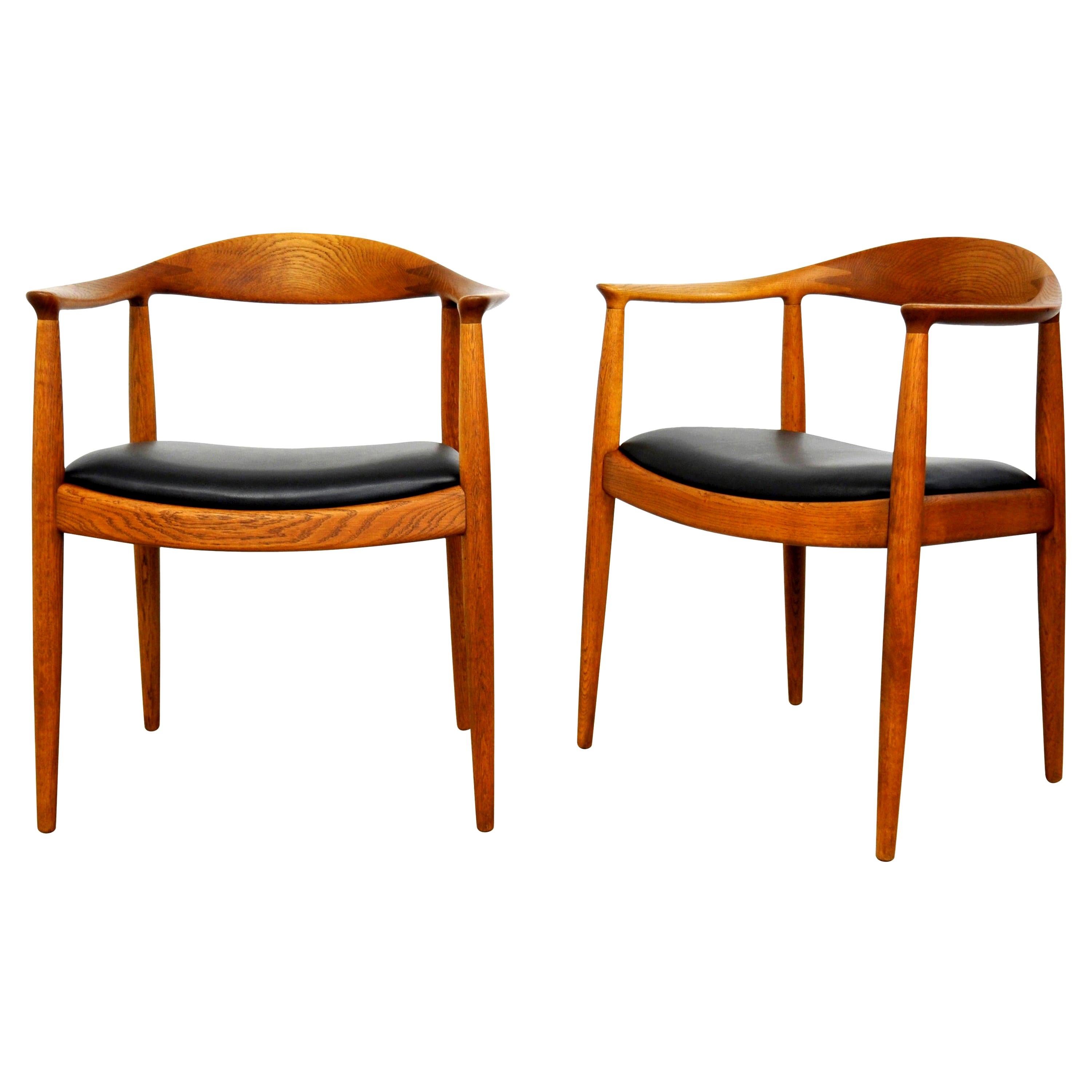 Pair of Hans Wegner for Johannes Hansen Oak and Black Leather Round Chairs