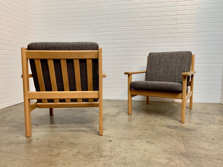 Great pair on Danish modern in white oak with gray fabric by Hans Wegner.