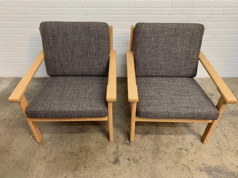 Upholstery Pair of Hans Wegner Lounge Chairs in Oak For Sale