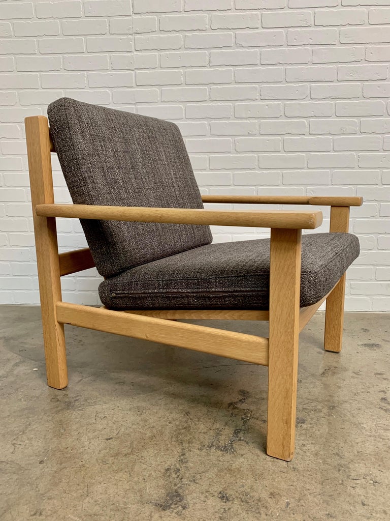 Danish Pair of Hans Wegner Lounge Chairs in Oak For Sale