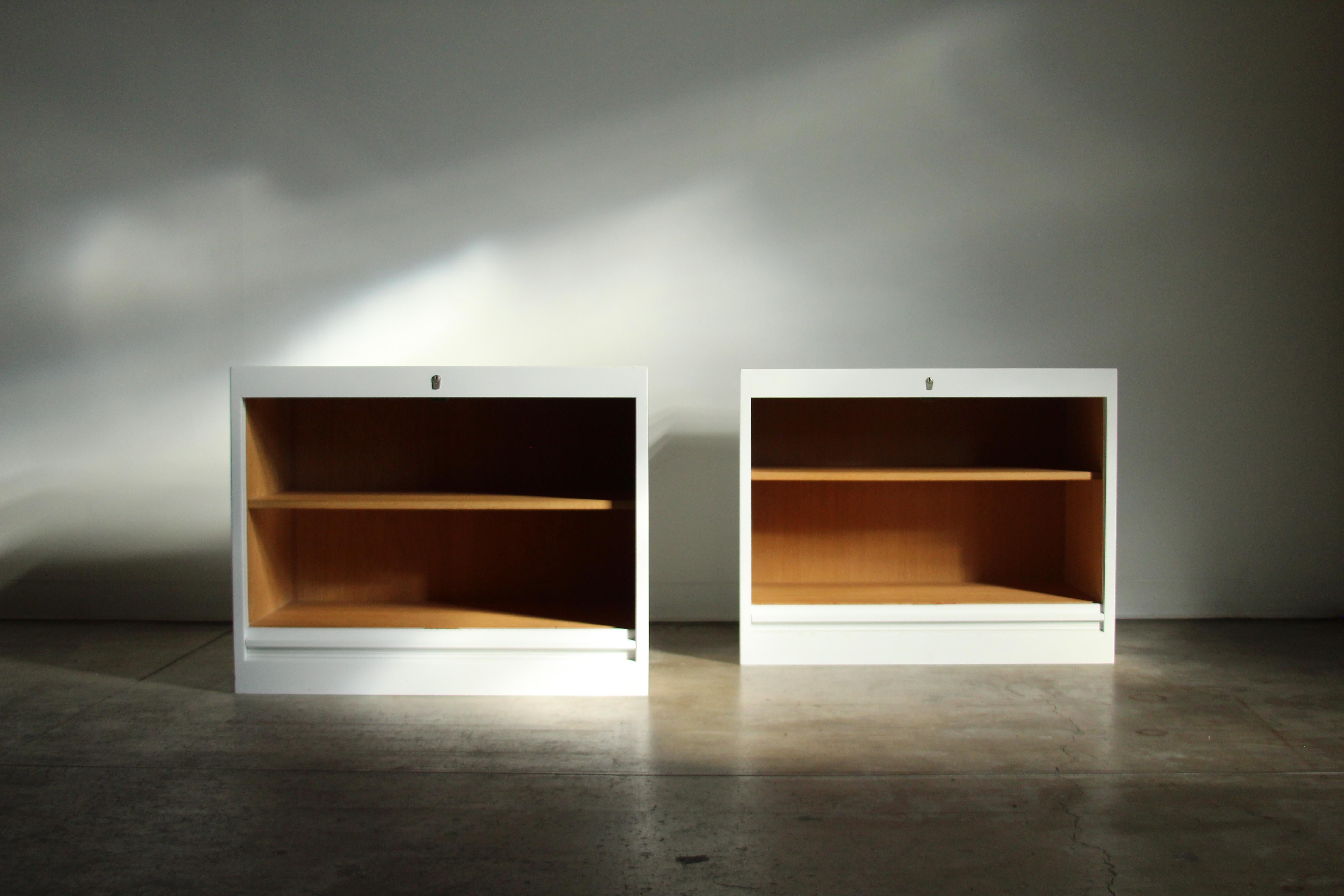 Pair of large, solid oak, white lacquered tambour cabinets designed by Hans Wegner for Johannes Hansen of Denmark in the 1960s. According to the original owner, the white lacquered finish is original. The cabinets are in good vintage condition,