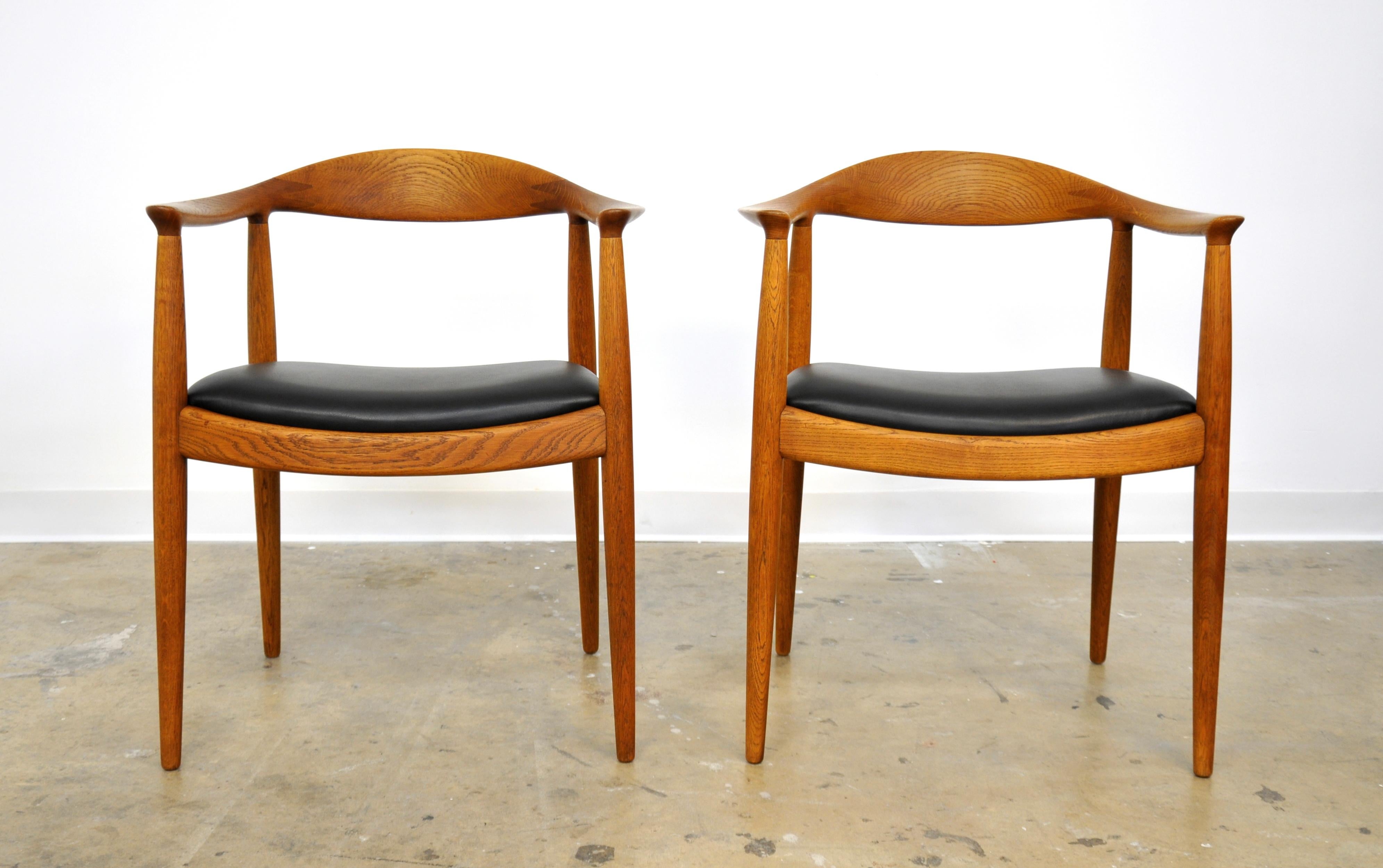 A gorgeous pair of iconic midcentury Danish modern JH 503 armchairs, also known as 