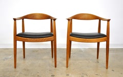 Pair of Hans Wegner for Johannes Hansen Oak and Black Leather Round Chairs