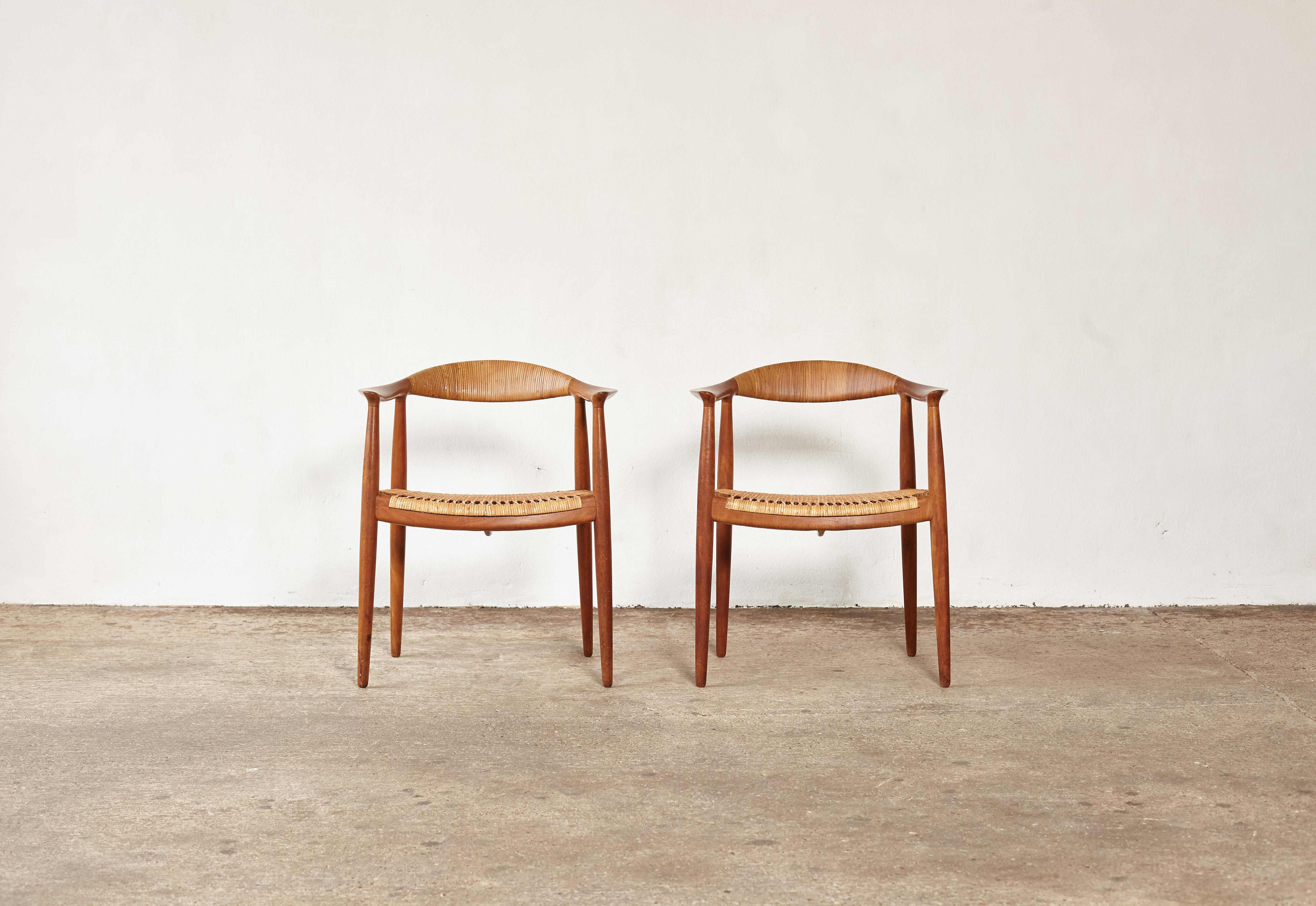 A fine pair of Hans Wegner's iconic 'The Chair', designed in 1949, model JH 501, made by Johannes Hansen, Denmark. This is the earliest version in mahogany with cane seat and backrest. Branded with makers mark.