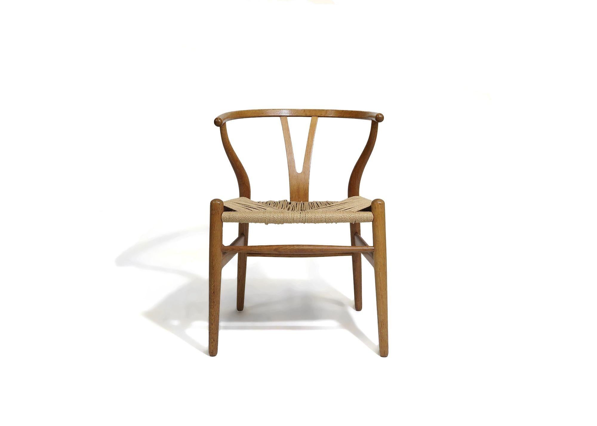 Pair of authentic Hans Wegner for Carl Hansen CH24 wishbone dining chairs in white oak with paper-cord seats. Stamped.
Measurements W 20.50'' x D 20.25'' x H 28.75''
Seat Height 16.75''.
