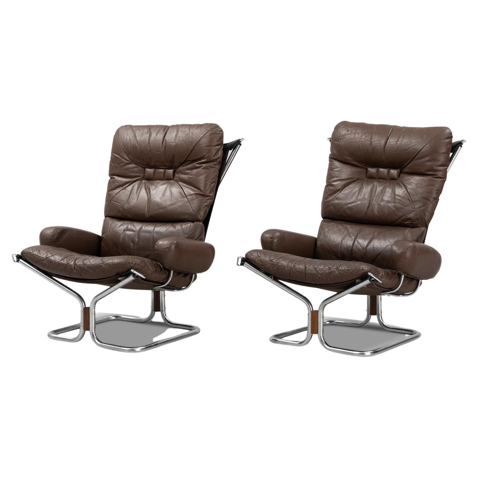 Pair of Harald Relling Highback Lounge Chairs in Leather + Chrome For Sale