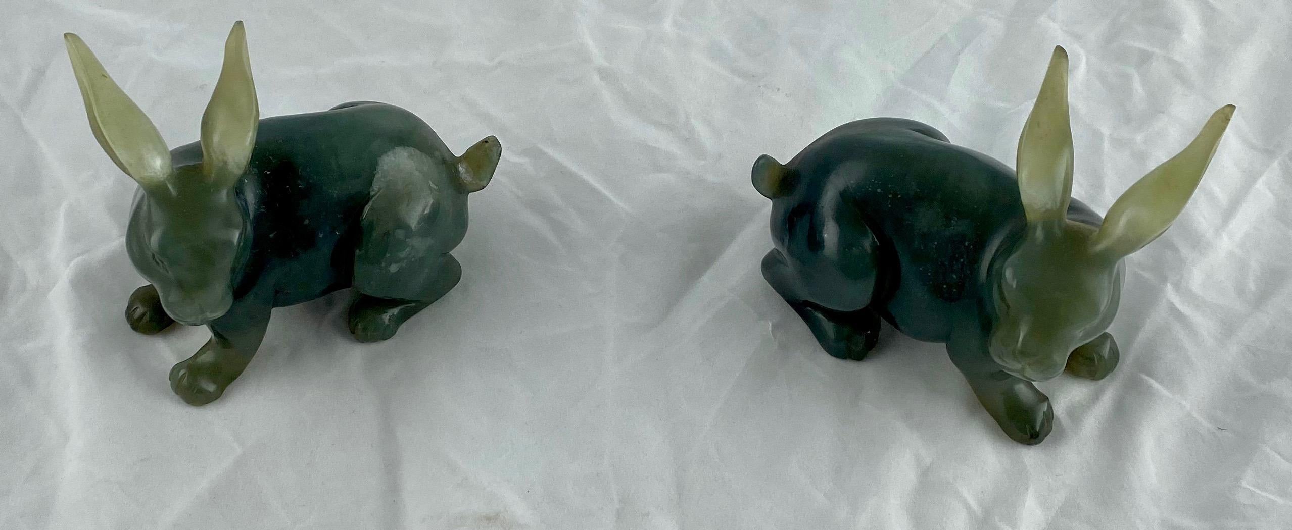 A pair of finely carved hard stone rabbits with long ears. A small restoration to one tail.