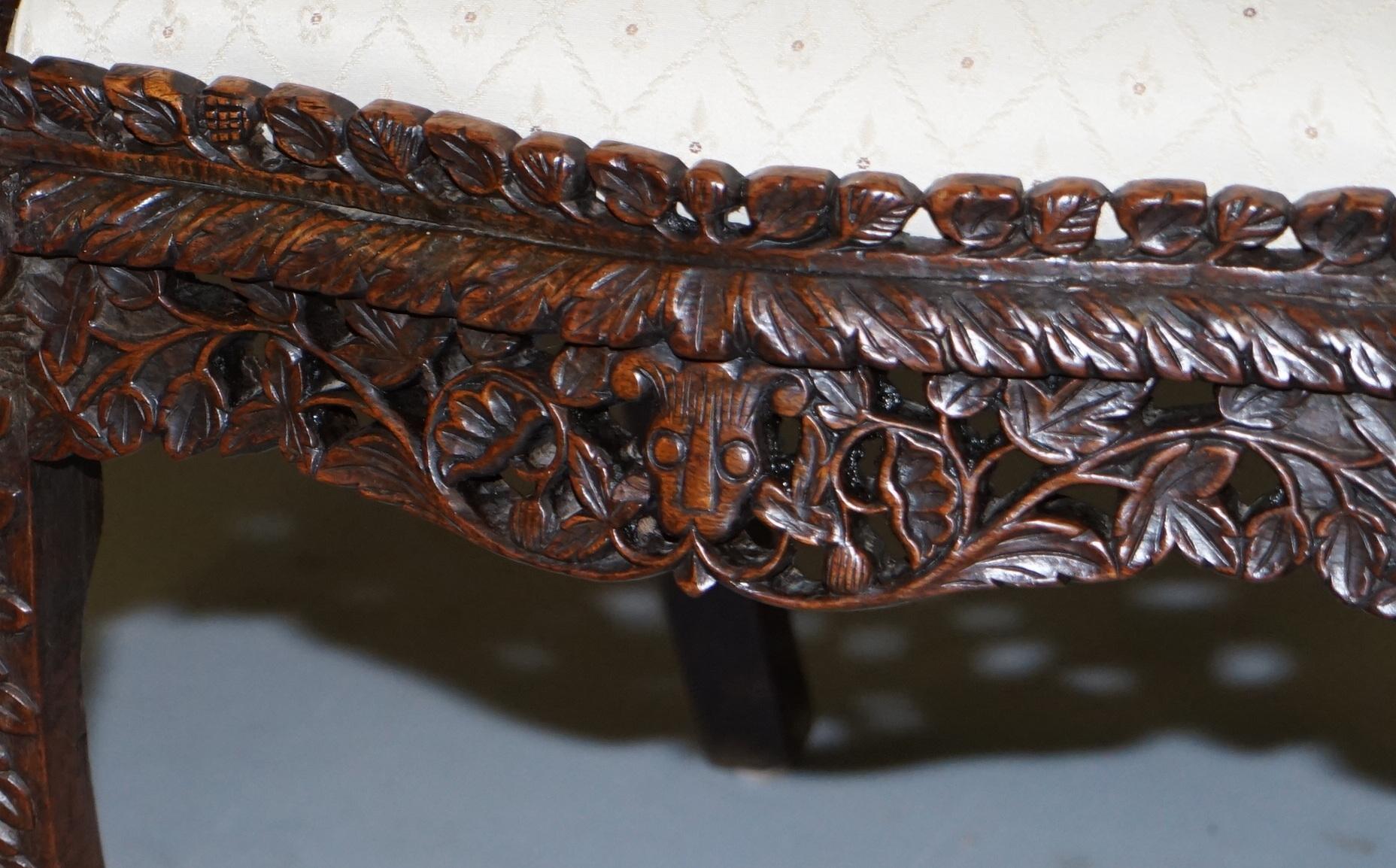 19th Century Pair of Hardwood Hand Carved Anglo Indian Burmese Chairs with Floral Detailing