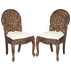 Antique Pair of Hardwood Hand Carved Anglo Indian Burmese Chairs with Floral Detailing