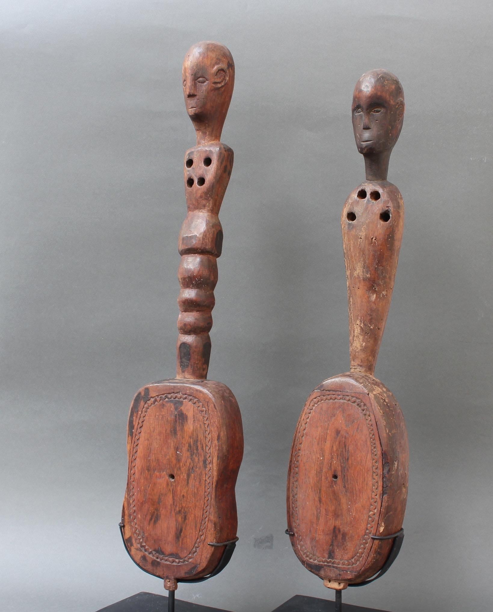 Indonesian Pair of Hardwood Sumbanese Lutes with Anthropomorphic Figures, 20th Century