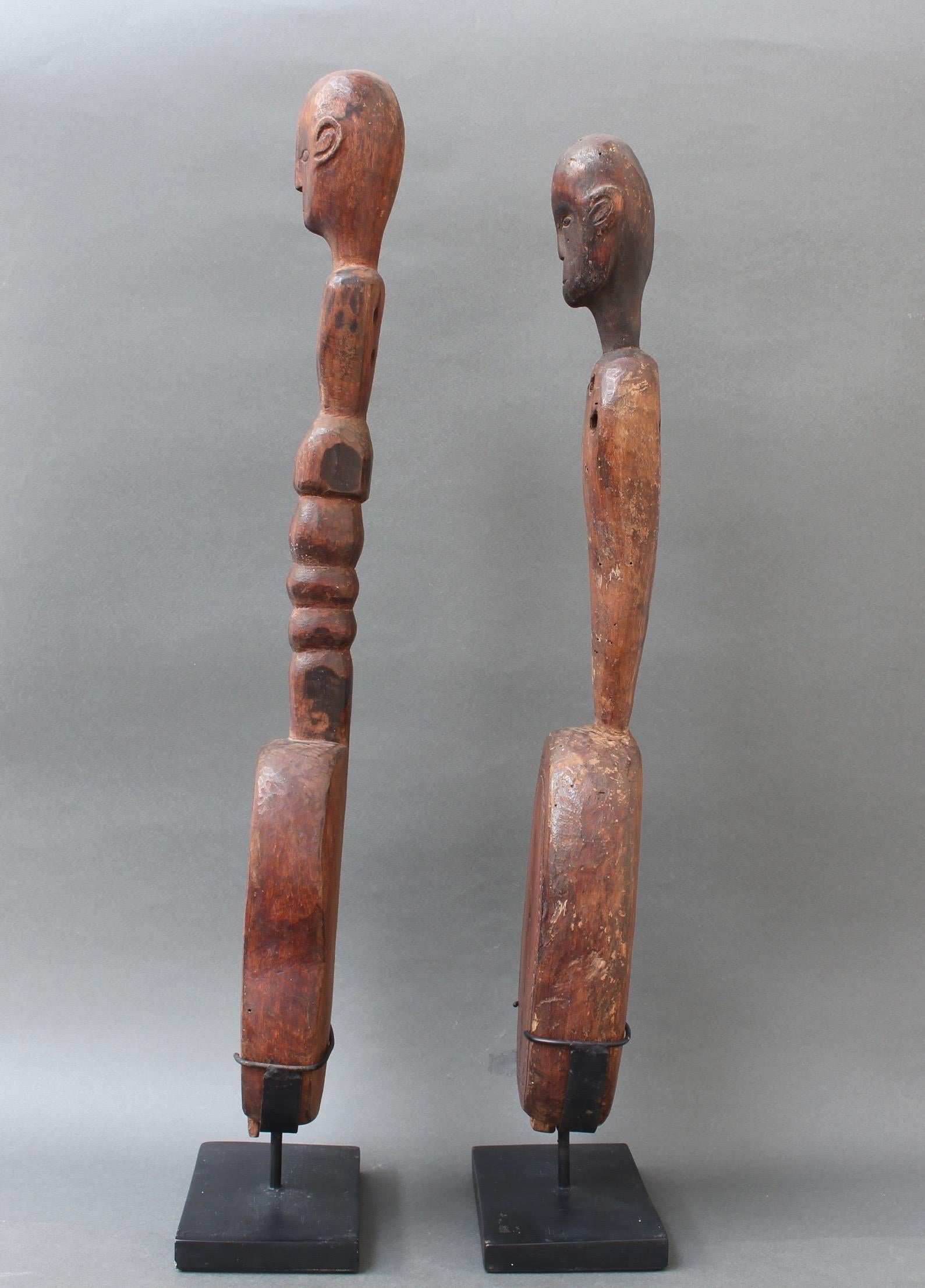 Hand-Carved Pair of Hardwood Sumbanese Lutes with Anthropomorphic Figures, 20th Century