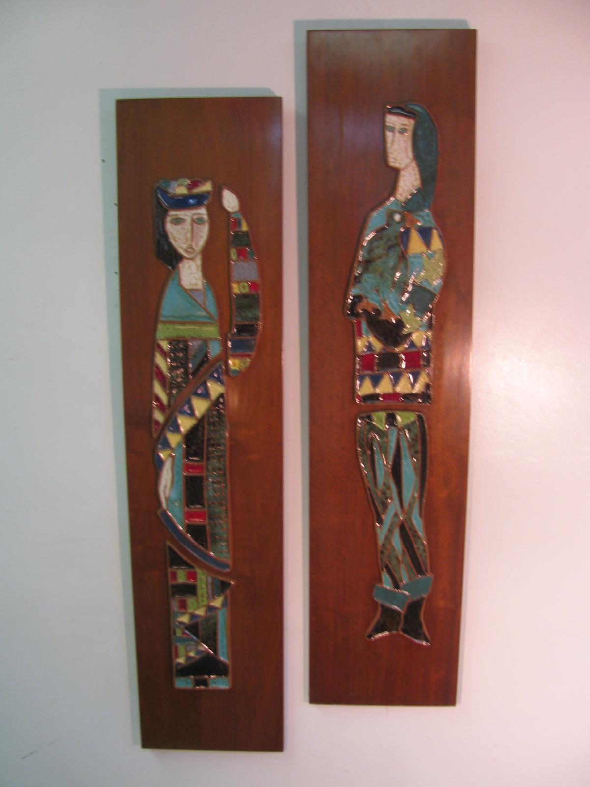 Beautiful pair of art tile plaques by Harris Strong. Two multicolored figures, king and queen, outfitted in harlequin dress. Mounted on walnut panels create a striking balance that would enhance all midcentury homes. Like the day the were created,