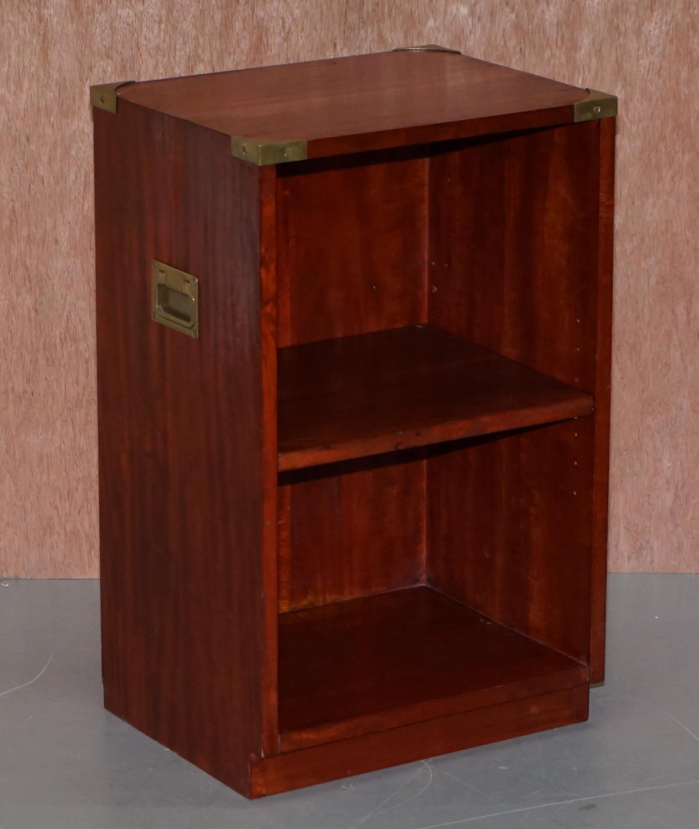 We are delighted to offer for sale this lovely pair of original vintage Kennedy Furniture side table sized bookcases retailed through Harrods London

In lovely flamed mahogany with solid brass fixtures and fittings, these are side table size and