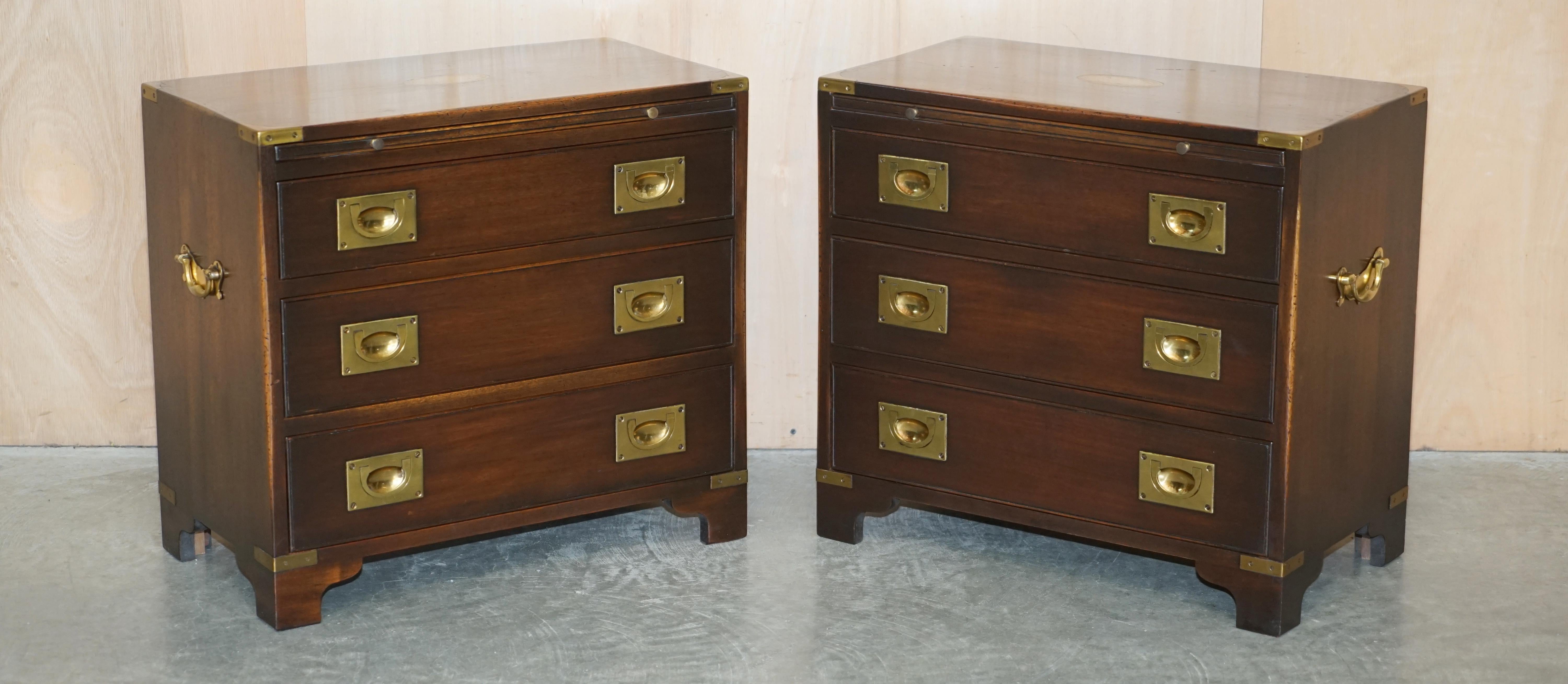 We are delighted to offer for sale this sublime pair of vintage, Harrods Kennedy Military Campaign chest of drawers with slip butlers serving trays 

A truly stunning and well made pair by Kennedy Furniture and retailed through Harrods London,