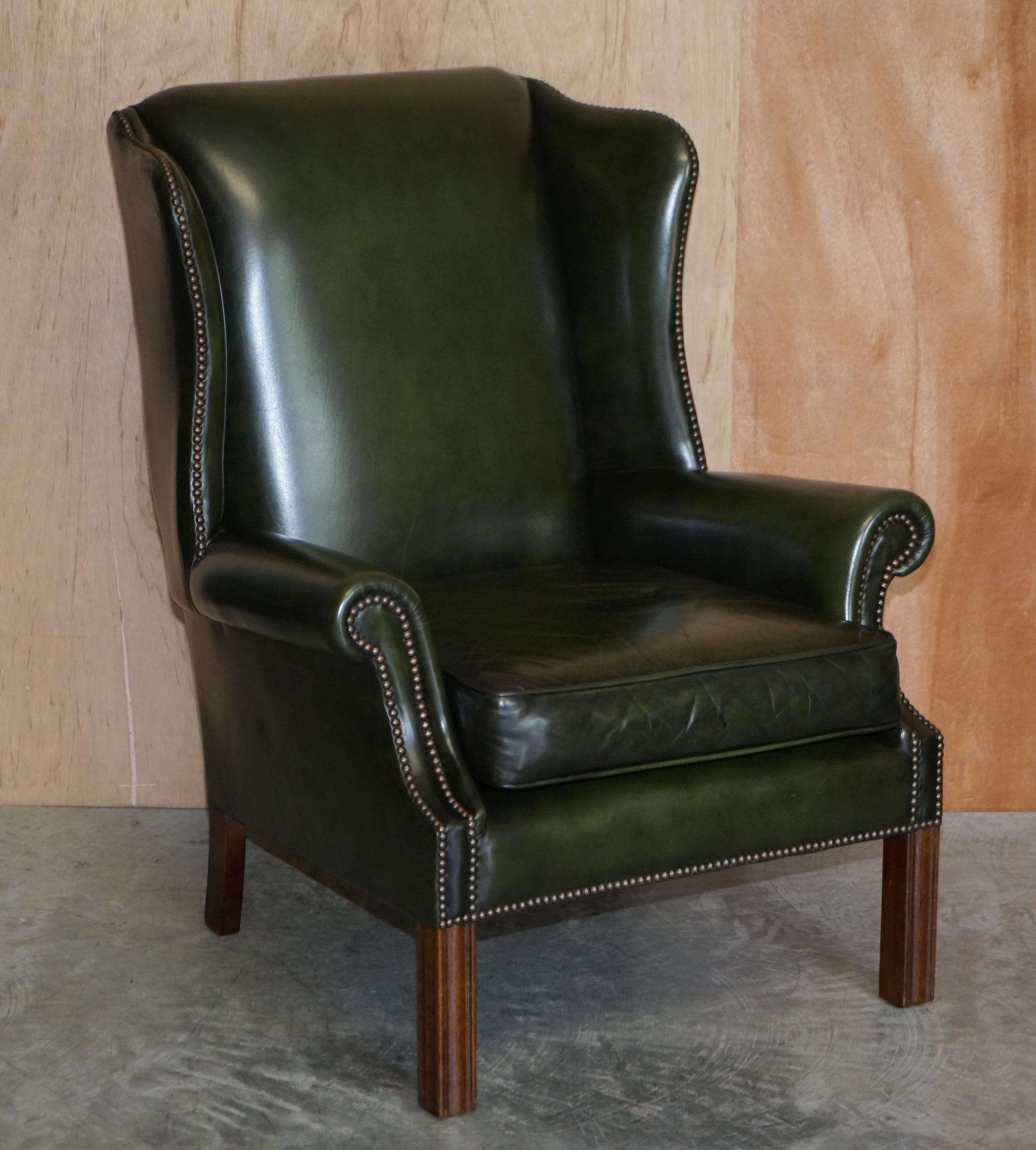 We are is delighted to offer for sale this pair of near new old stock condition, Harrods London retailed, Pegasus Art Forma made, regency green leather wingback armchairs.

These chairs are wonderfully English! They have a slightly more relaxed