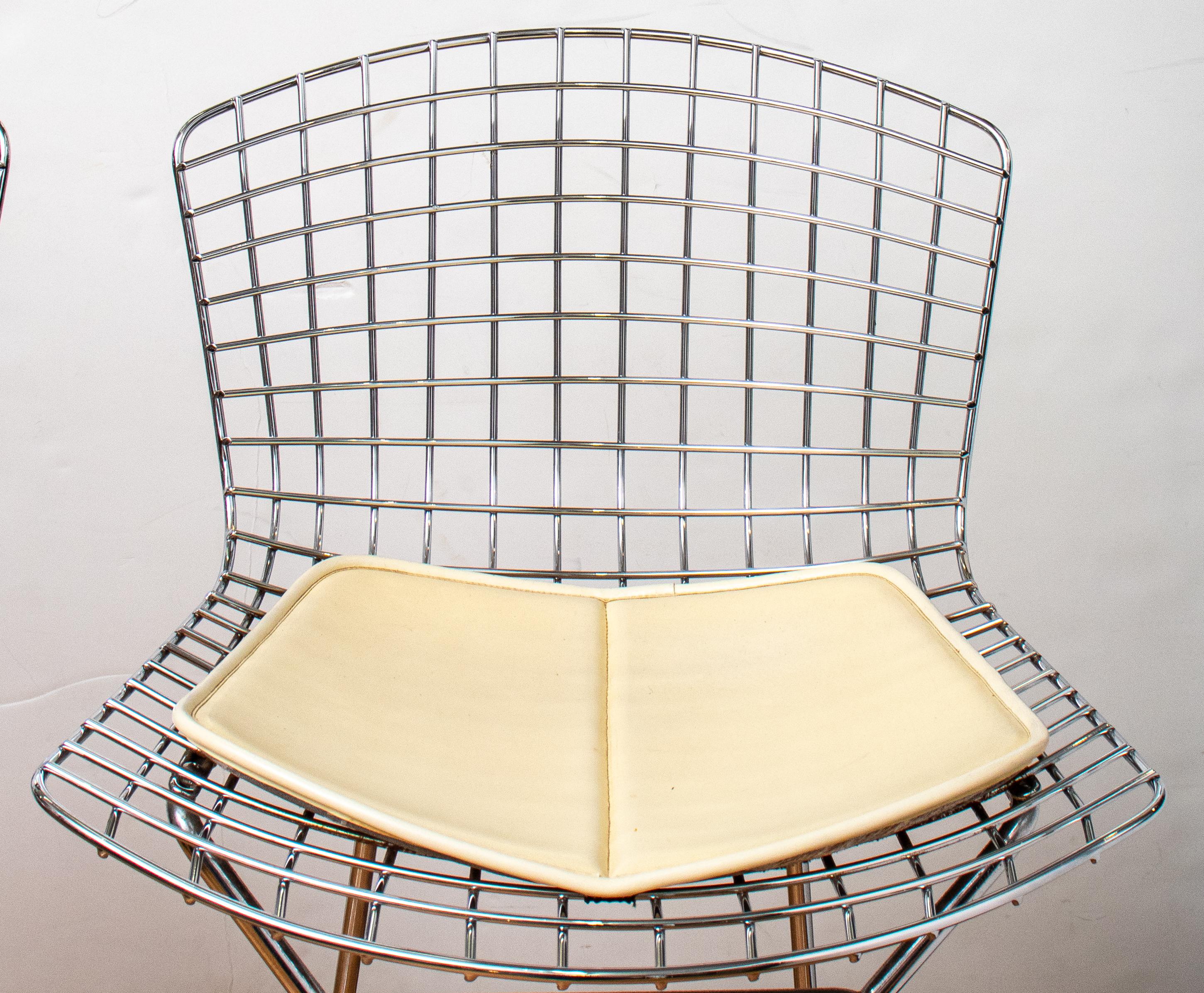 Pair of modern contemporary Harry Bertoia (Italian/American 1915-1978) for Knoll chrome metal bar stool chairs with lattice seats and backs and original Knoll cushions, both marked. 38.5