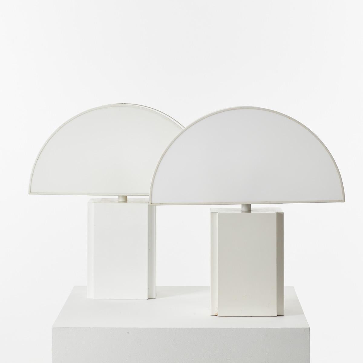 Large Olympe table lamp designed by Harvey Guzzini for ED, Italy 1970s. The demilune shade is particularly pleasing lit, a half moon of ambient light through semi-opaque acrylic. It has a metal base and a plastic shade, open at the back for ease of