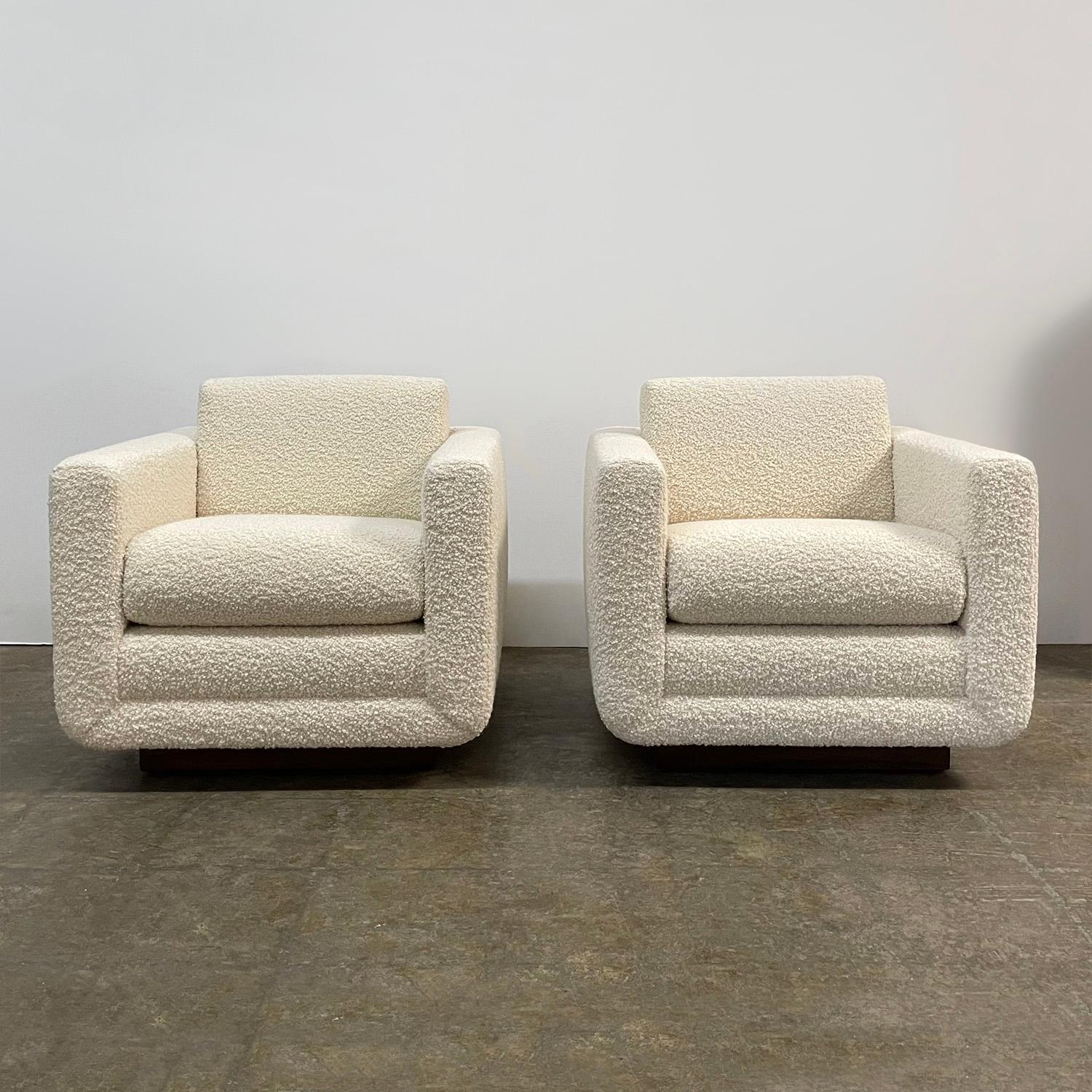Pair of Harvey Probber club chairs
America, circa 1960’s
Comfy yet stylish with great lines and design 
Newly reupholstered in buttery soft wool boucle
Reconditioned walnut plinth base
*We have a modified version of this chair available for new
