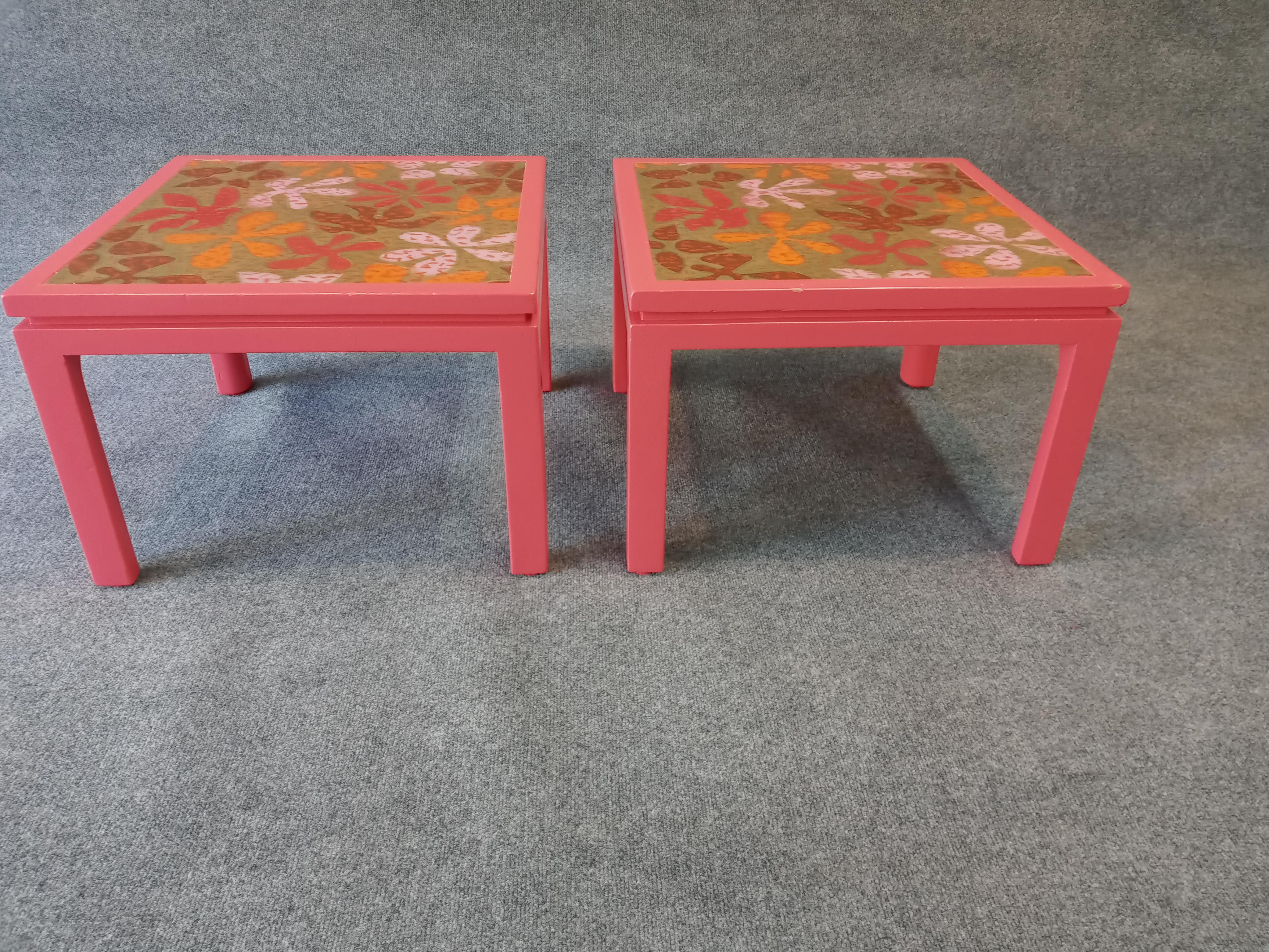 Rare 1960s psychedelic flower design side tables with baked enamel on copper inset panels. With era-appropriate vibrant enamel on original mahogany bases. The tops have a durable and luxurious finish with only minor chips to each. The bases have