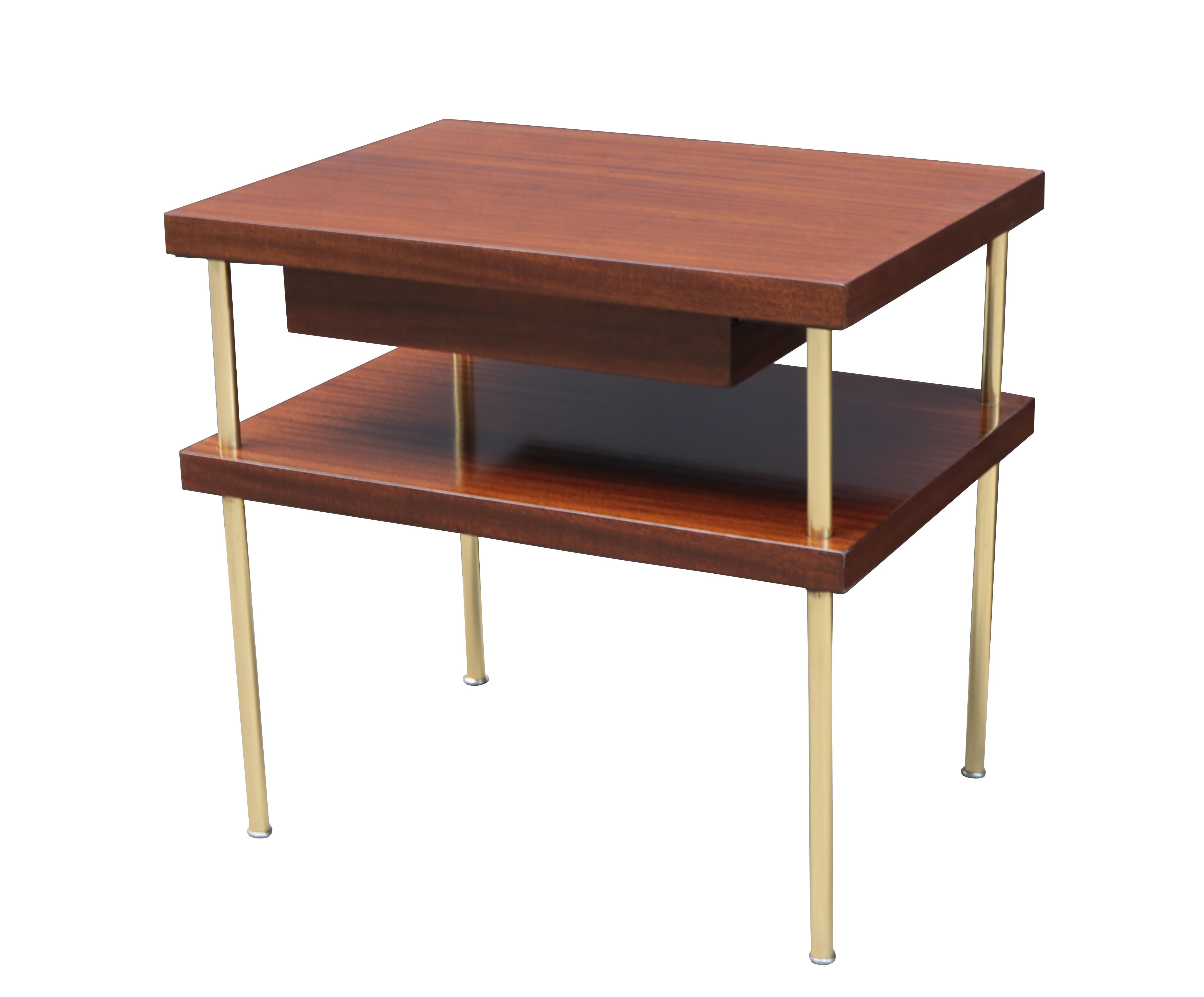 A pair of Harvey Probber designed end tables.
Mahogany with brass legs.
Each with single utility drawer.
 