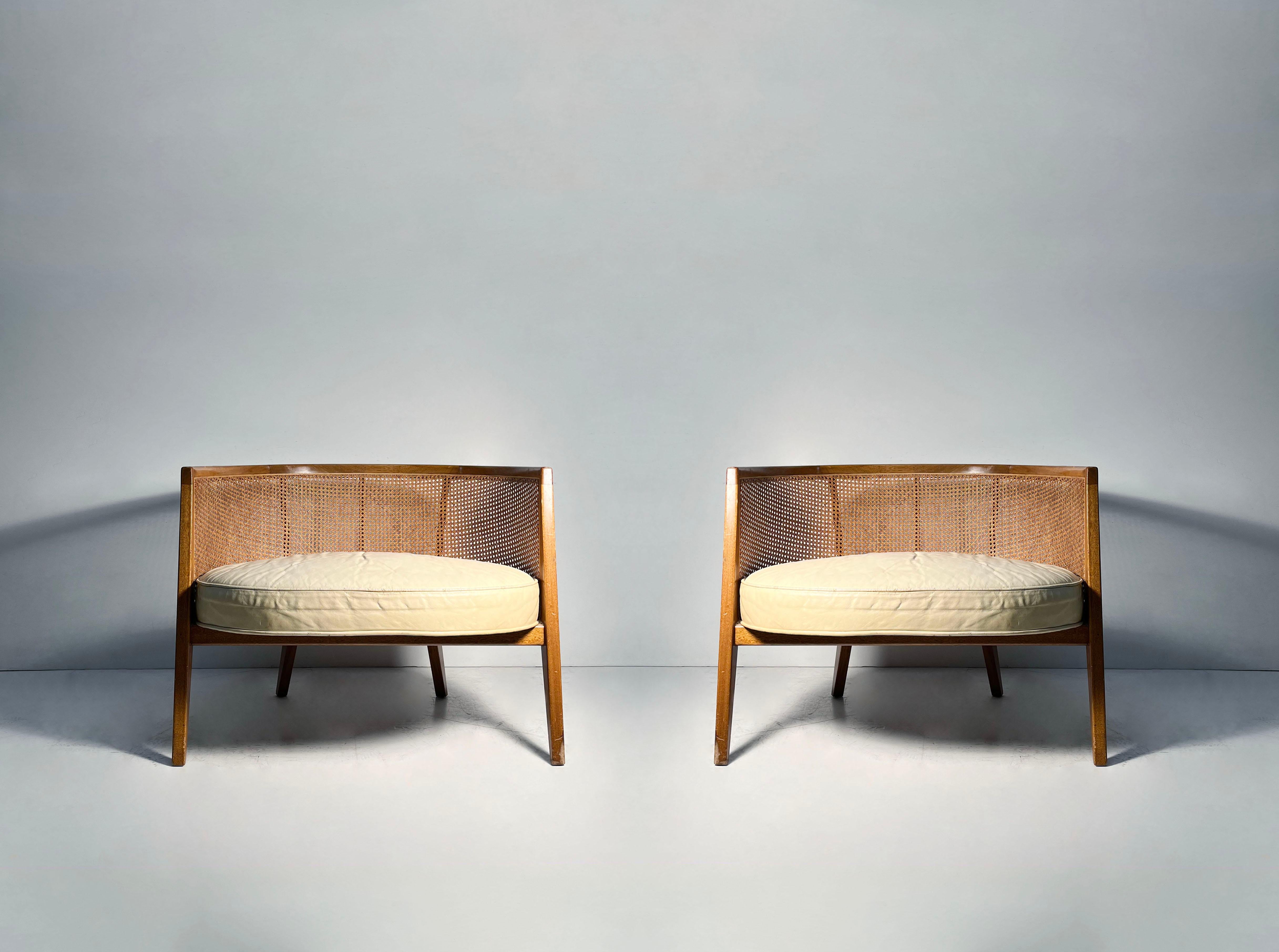 Pair of Harvey Probber Hoop Barrel Back Cane Lounge Chairs

Wear to original finish. Cane in nice shape. Pronbably requires reupholstery. Original leather is aged.  Back cushions were not with the chairs when acquired.

Please request additional