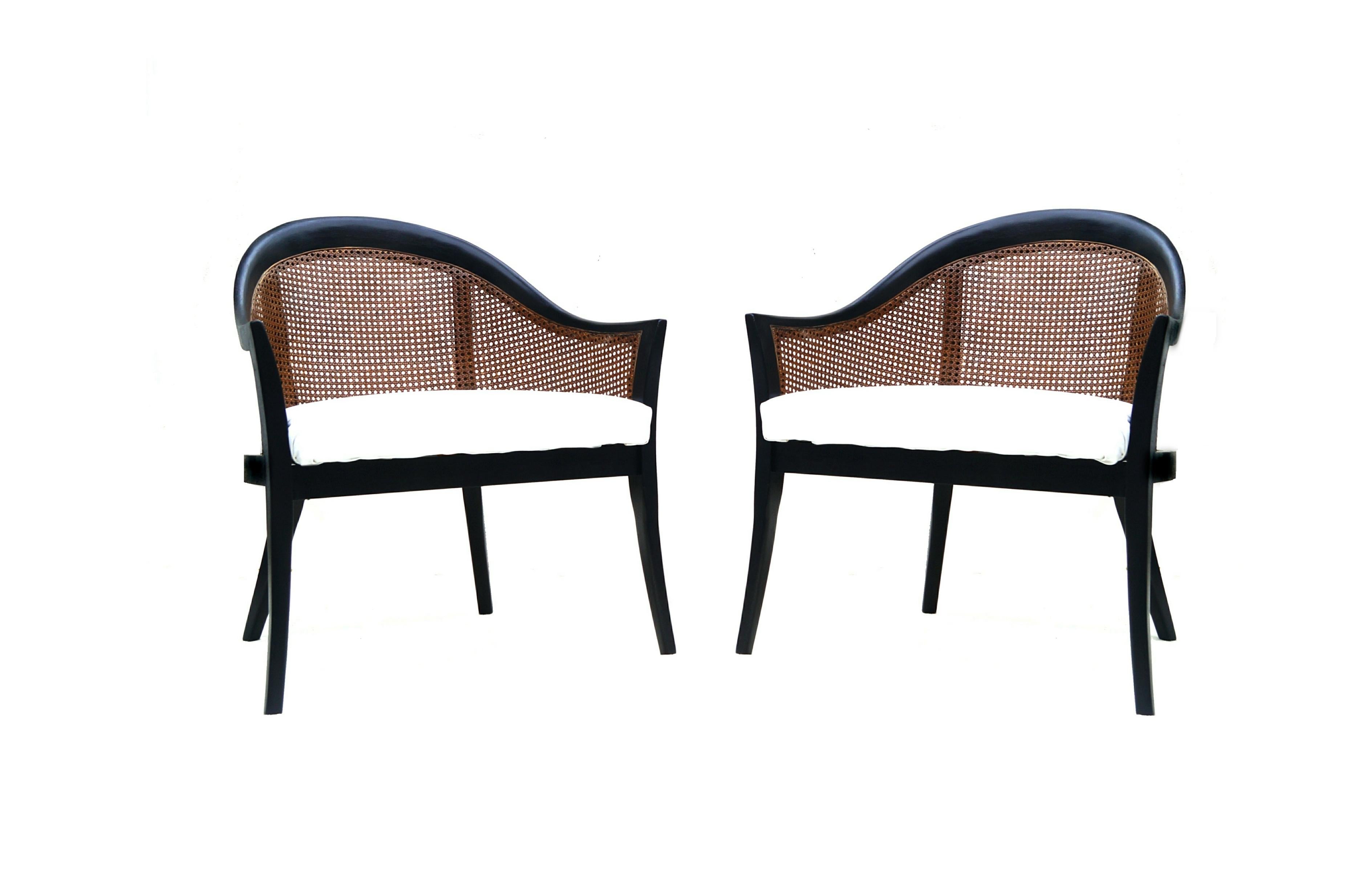 Pair of Harvey Probber lounge chairs painted black with original tone caned barrel back
