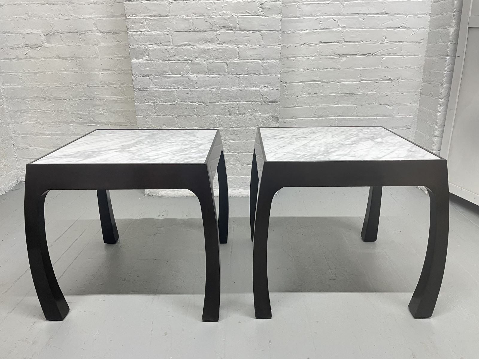 Pair of Harvey Probber 1960s Carrara marble top end tables. The frames of the tables are mahogany with a dark lacquered finish. Tables have curved legs.