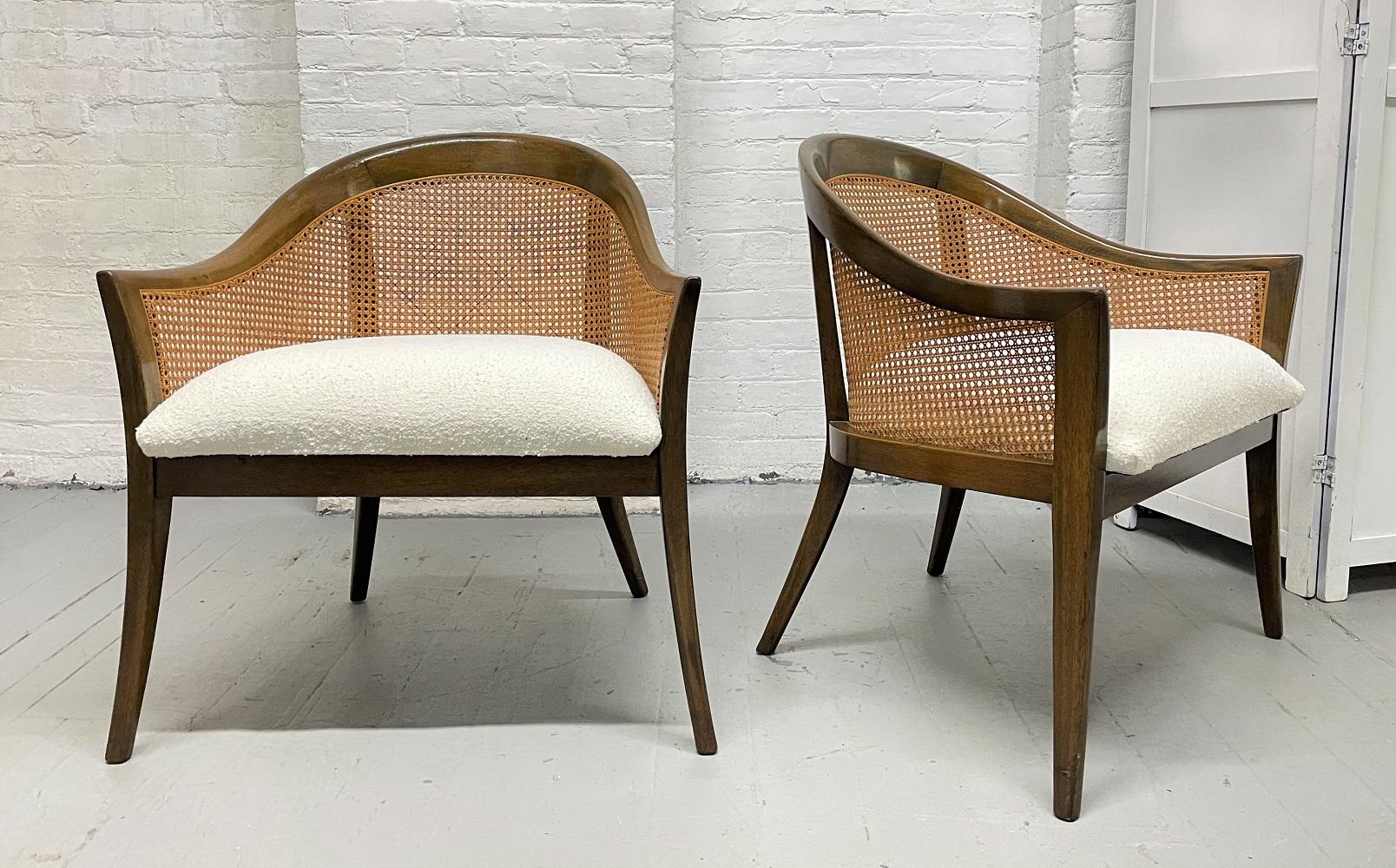 Pair of Harvey Probber side or lounge chairs. The chairs have mahogany and caned frames, splayed legs with a cushioned seat done in Bouclé. Mid-Century Modern.