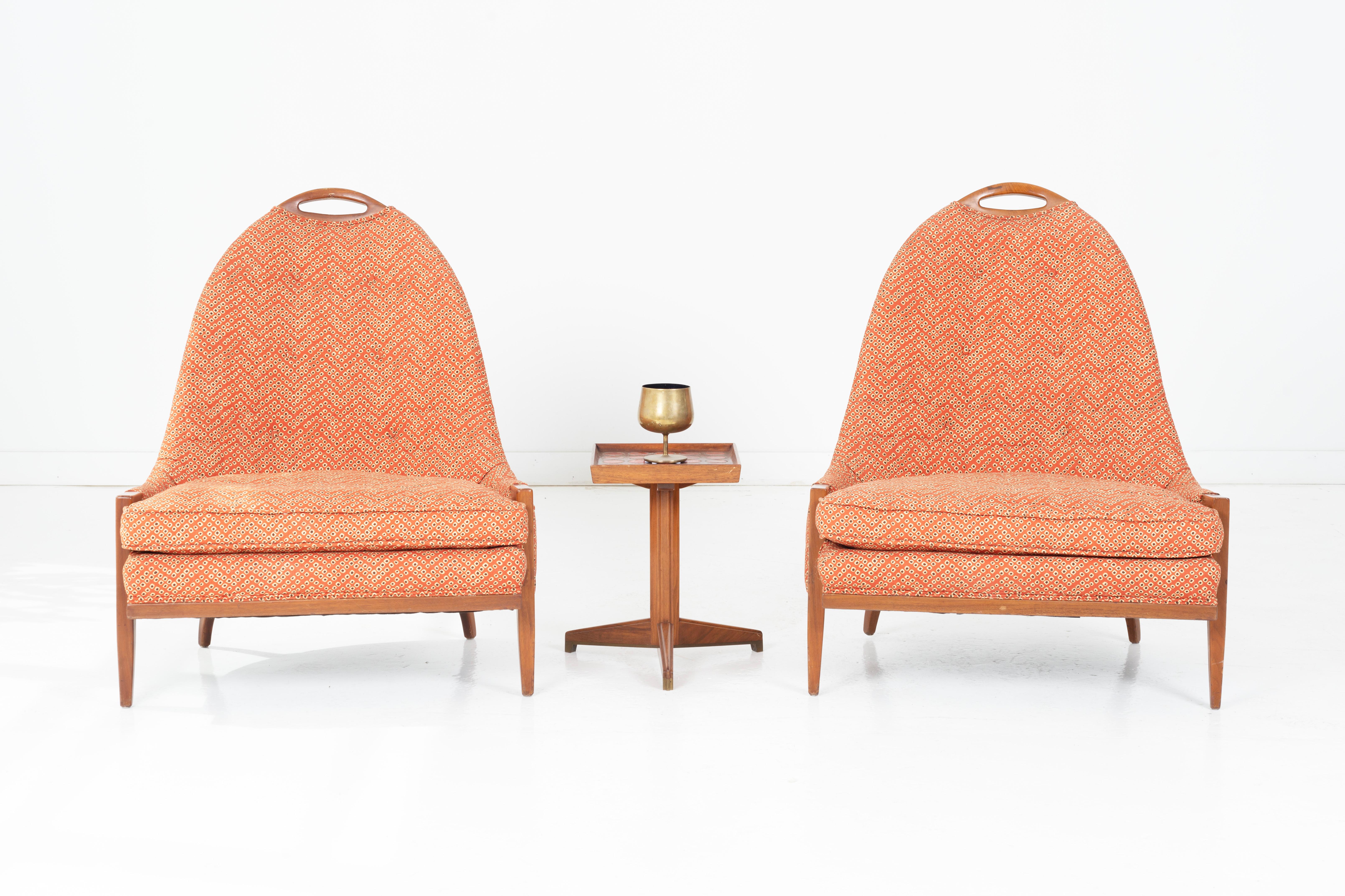 This exquisite pair of 1960s vintage slipper chairs, designed in the style of renowned mid-century modern furniture designer Harvey Probber, exudes sophistication and charm. The chairs feature elegant walnut handle backs and exposed walnut arms,