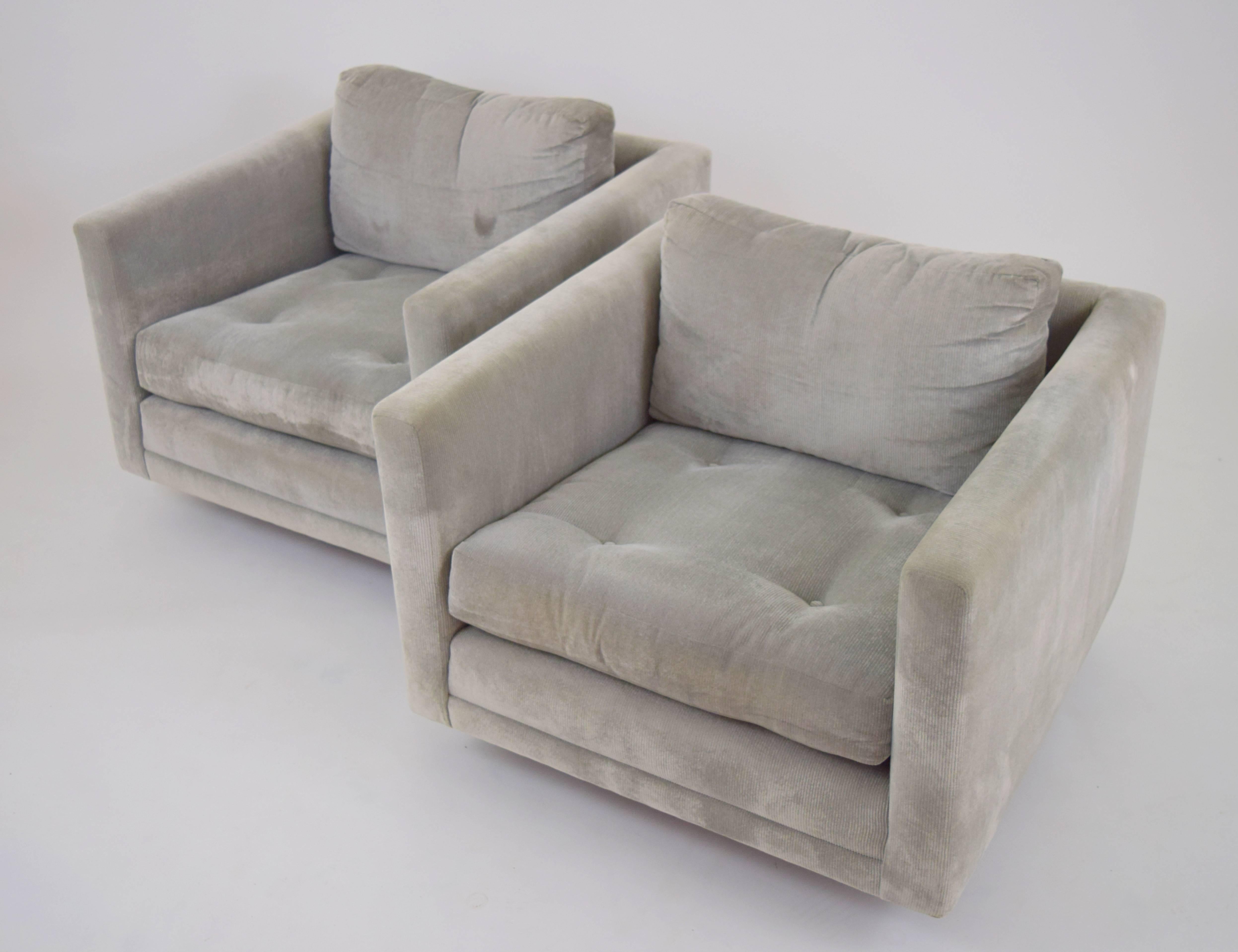 Minimalist pair of swivel cube chairs by Harvey Probber on round walnut bases. Button tufted seats and down cushion blend backs previously upholstered in a silver velvet corduroy.
