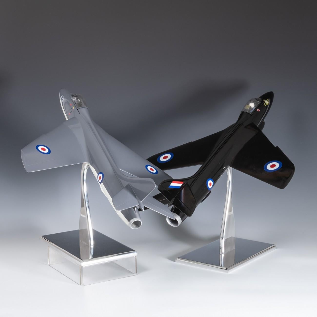 Wonderful pair of 1950s-1960s carved wooden scale models of the Hawker Hunter fighter jet. These models had lost their stands and were generally in a poor decorative state when we found them so have been re-painted and mounted on newly made polished