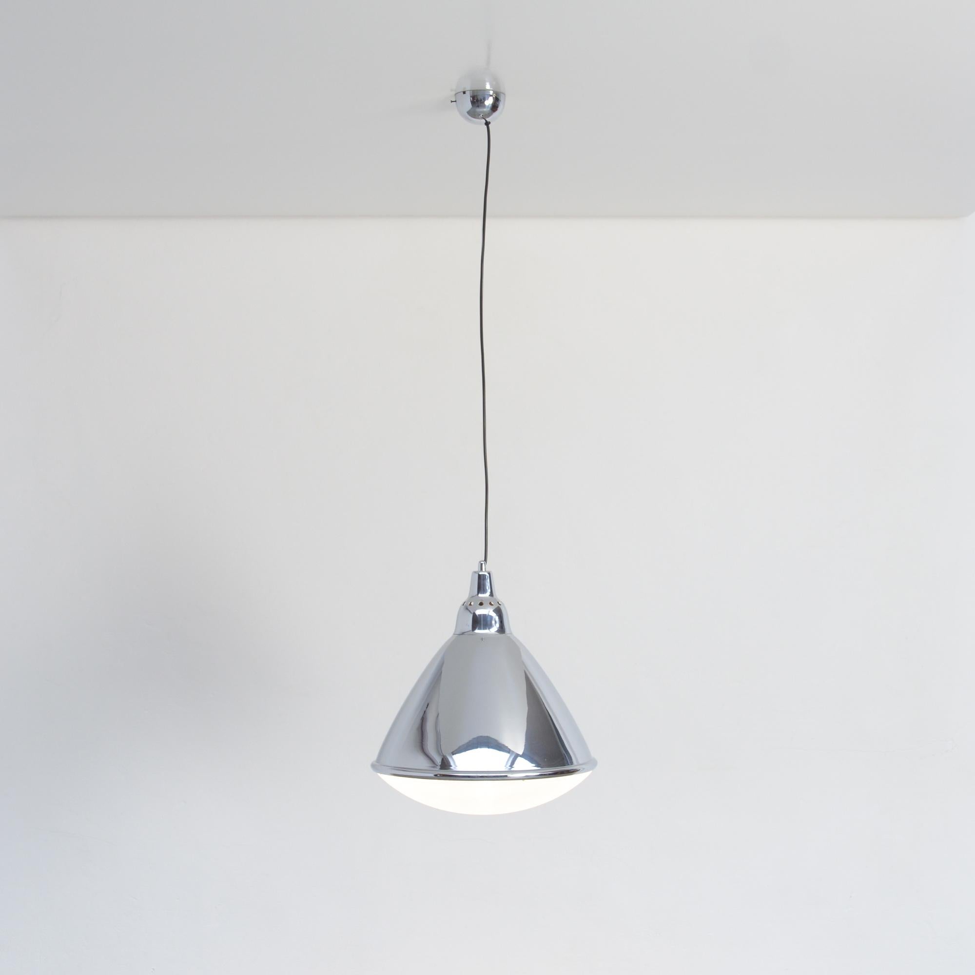 This cone shaped pendant lamp headlight was designed by Ingo Maurer in 1968. It was manufactured by Design M.
The shade and canopy are made of chromed metal and the diffuser is made of transparent plastic.
Both lamps are in very good condition.