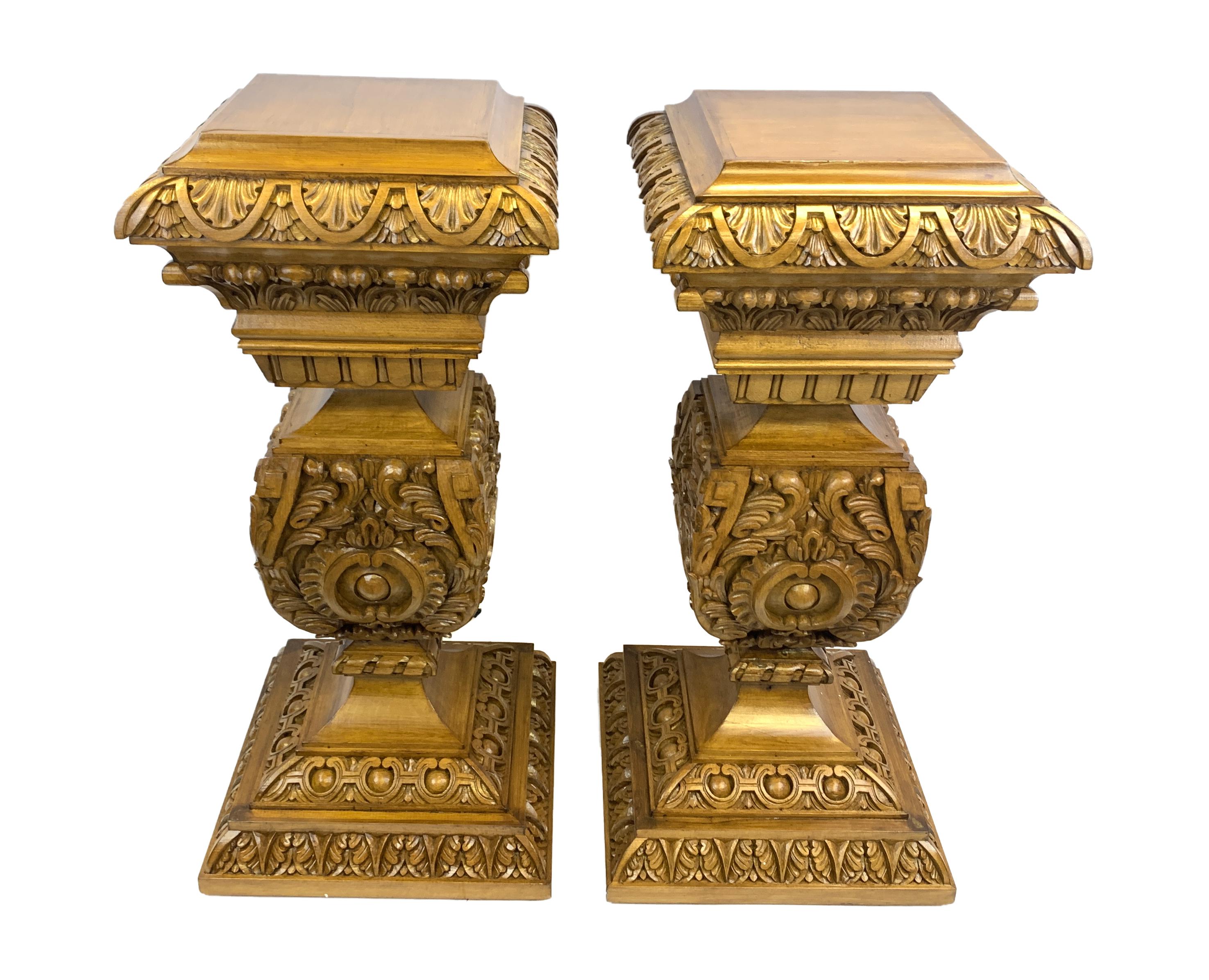 A fine pair of baroque style pedestals, rich in details and colour, carved from beech wood.