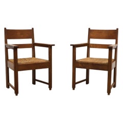 Ein Paar schwere und Classic Pierre Chapo inspirierte Oak und Rush Sessel