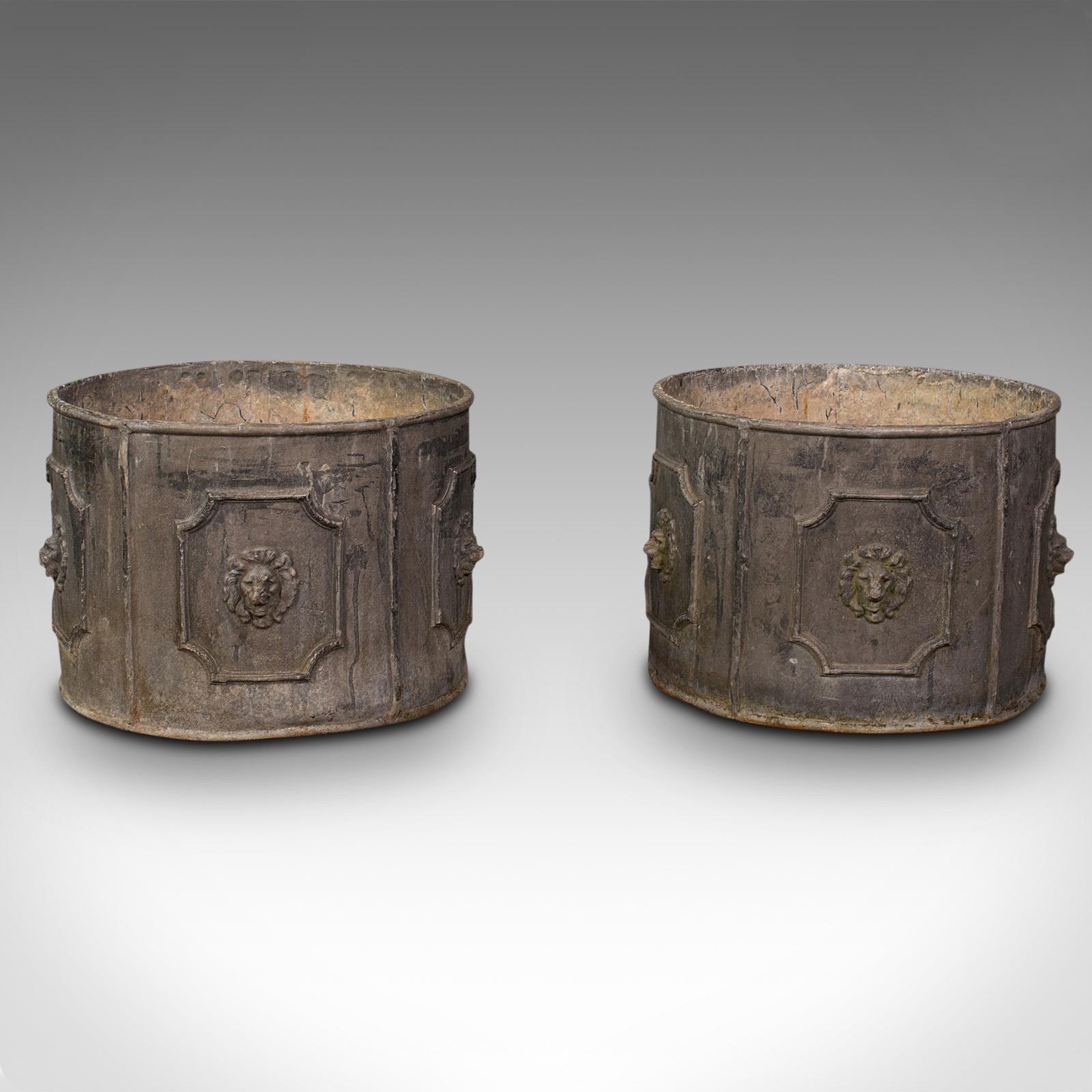This is a pair of heavy antique planters. An English, lead circular planting pot, dating to the mid Victorian period, circa 1850.

Impressively heavy planters with tasteful Victorian period decoration
Displaying a desirable aged patina