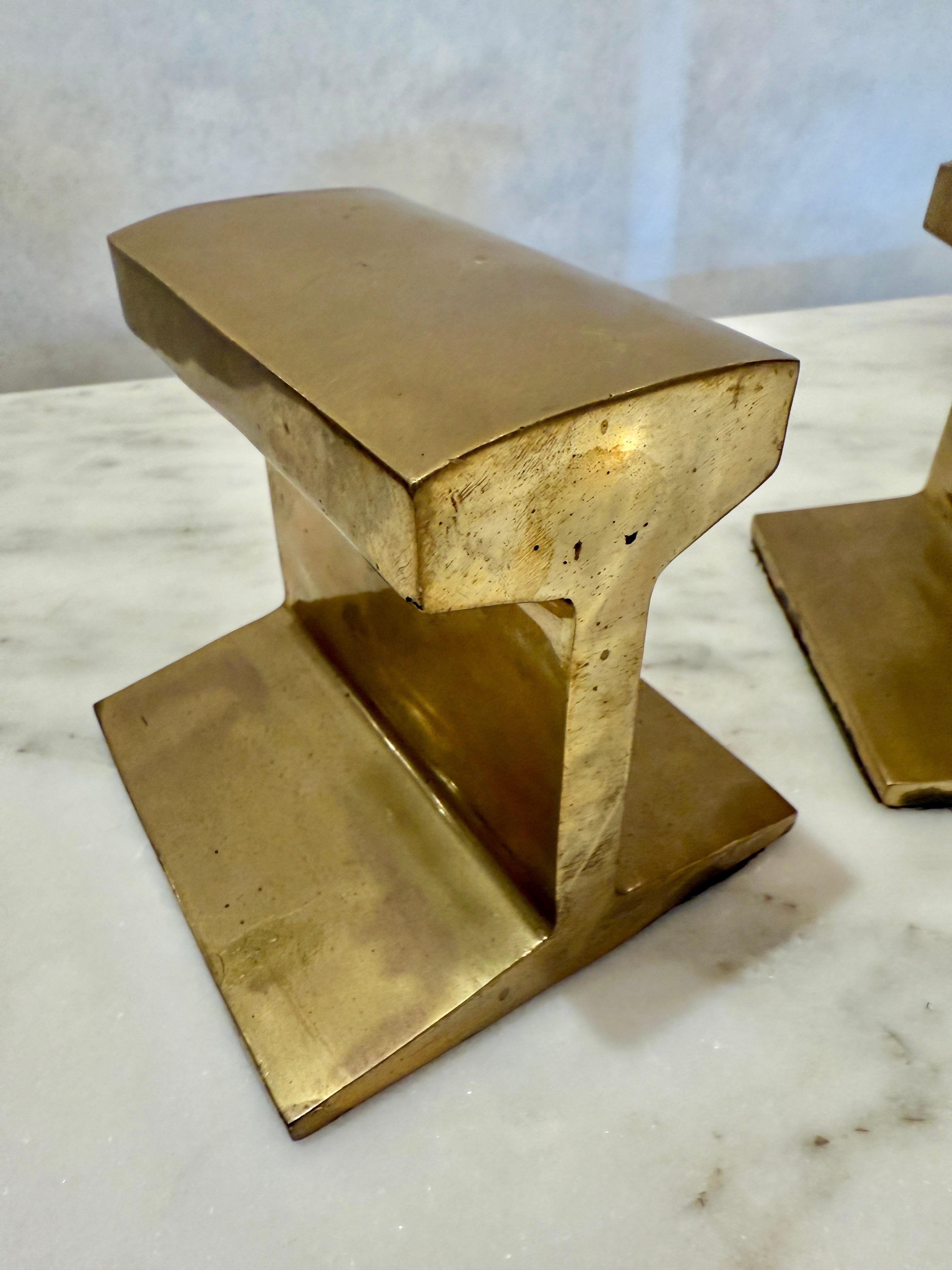 Cast I-Beam Bookends, in the Style of Ben Seibel.   Shape is cast brass with felt on the bottom
Great patina.
